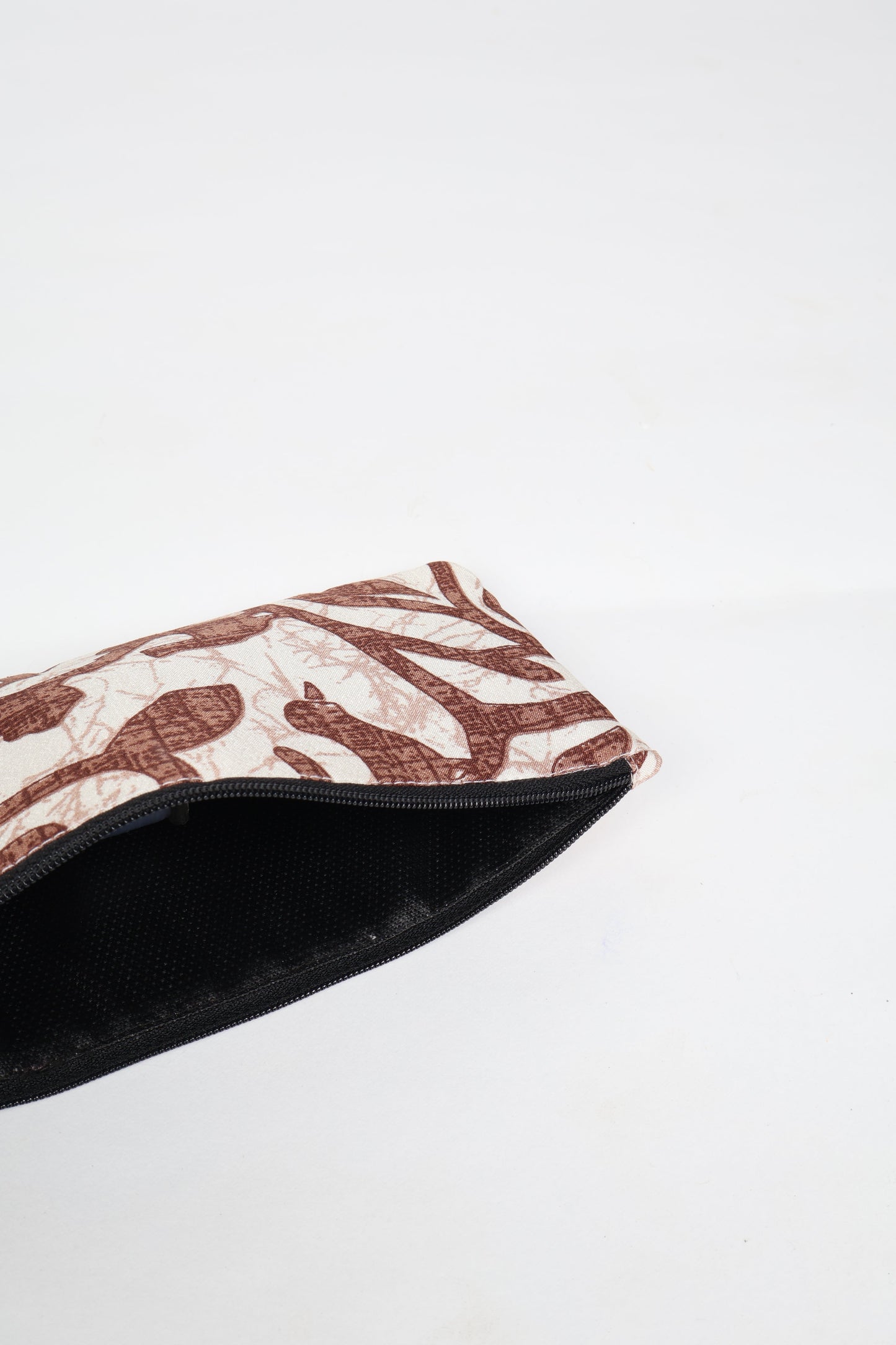 Eco-conscious quilted pencil pouch with waterproof lining made from upcycled garments, reflecting the values of circular fashion, carbon neutral fashion, and repurposed clothing. A perfect example of green fashion and sustainable women's clothing.