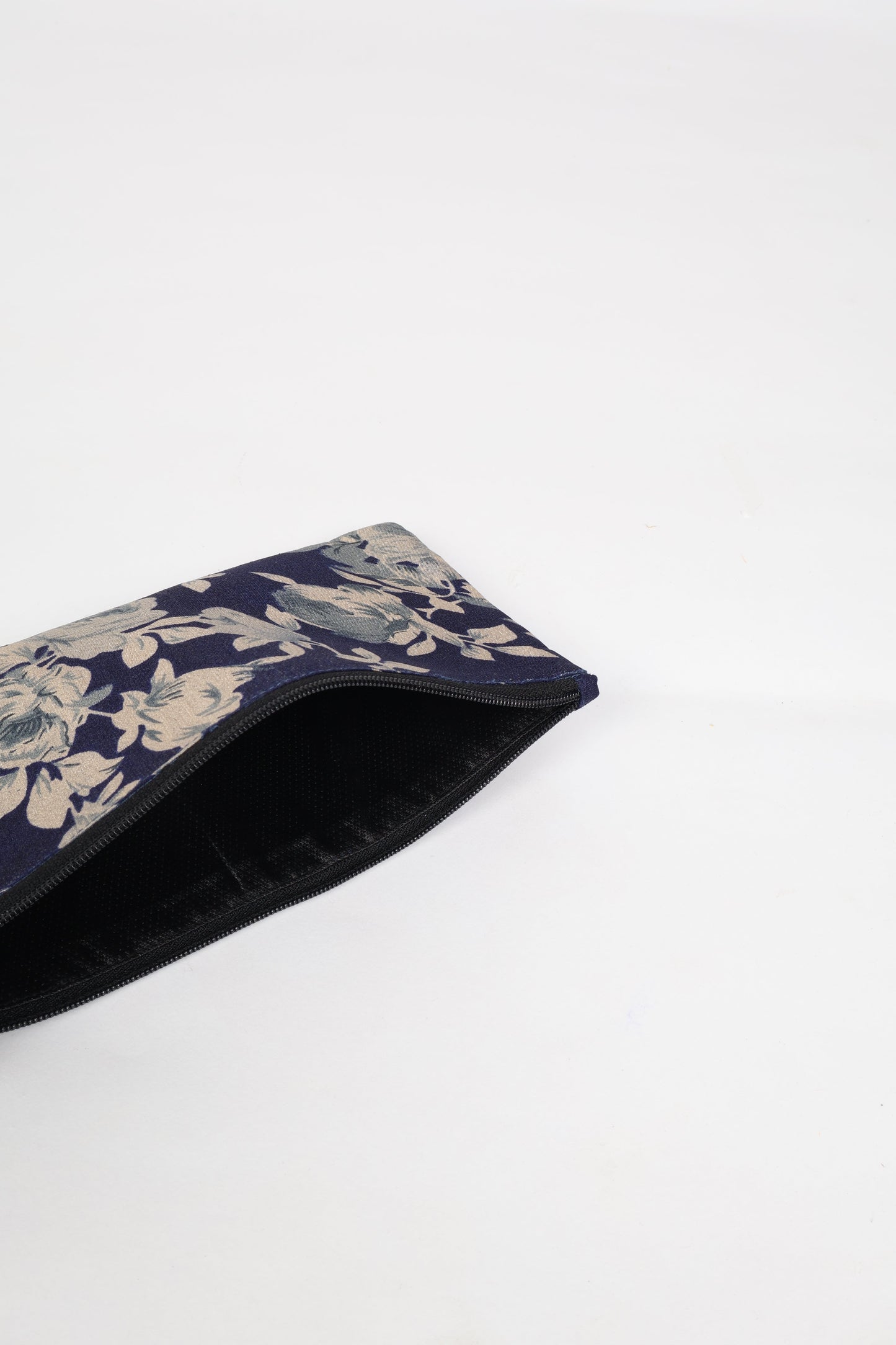 Eco-conscious quilted pencil pouch with waterproof lining made from upcycled garments, reflecting the values of circular fashion, carbon neutral fashion, and repurposed clothing. A perfect example of green fashion and sustainable women's clothing.