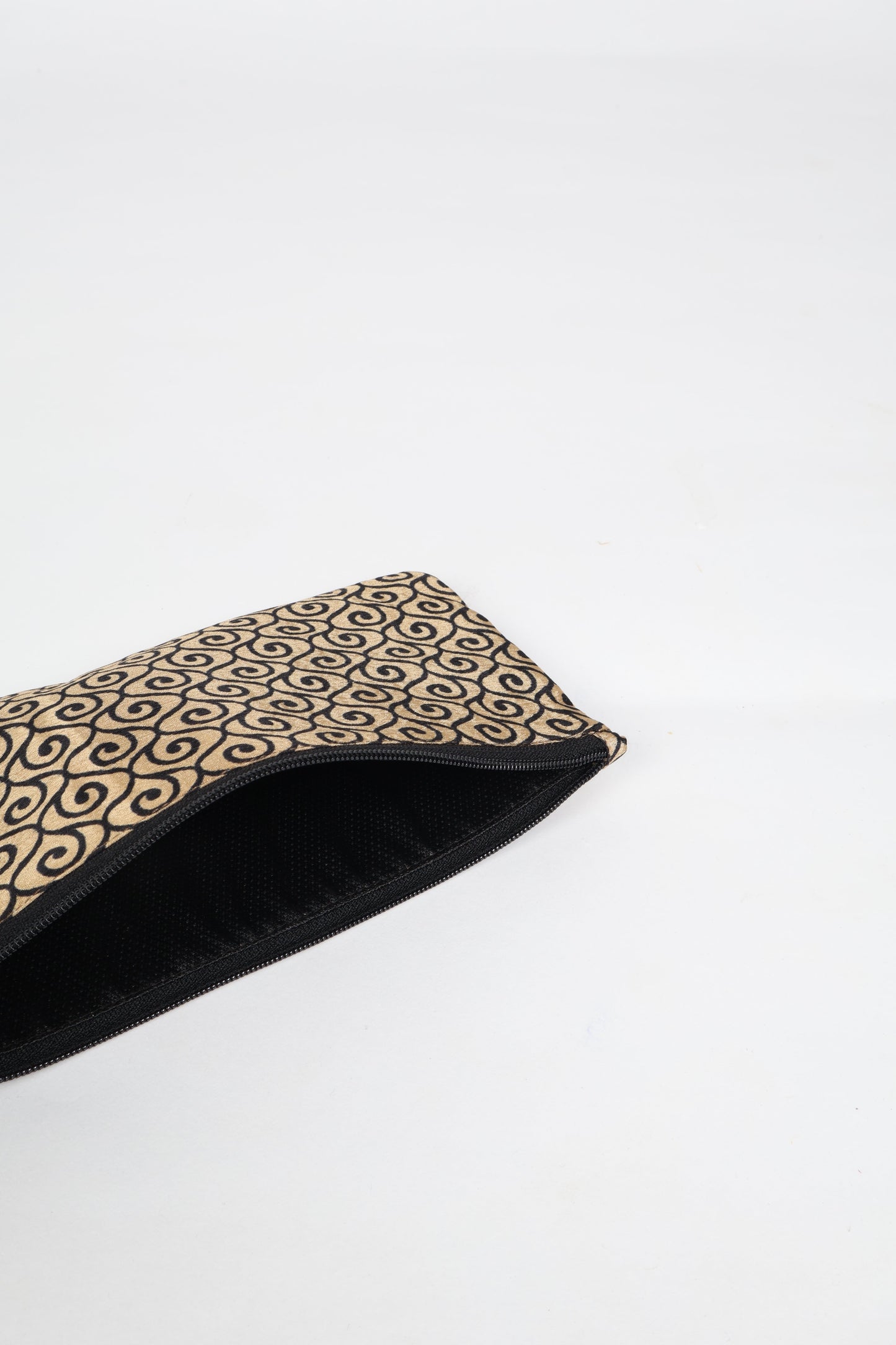 Eco-conscious quilted pencil pouch with waterproof lining made from upcycled garments, reflecting the values of circular fashion, carbon neutral fashion, and repurposed clothing. A perfect example of green fashion and sustainable women's clothing.