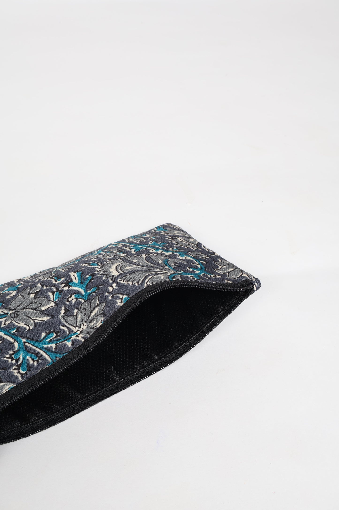 Eco-conscious quilted pencil pouch with waterproof lining made from upcycled garments, reflecting the values of circular fashion, carbon neutral fashion, and repurposed clothing. A perfect example of green fashion and sustainable women's clothing.