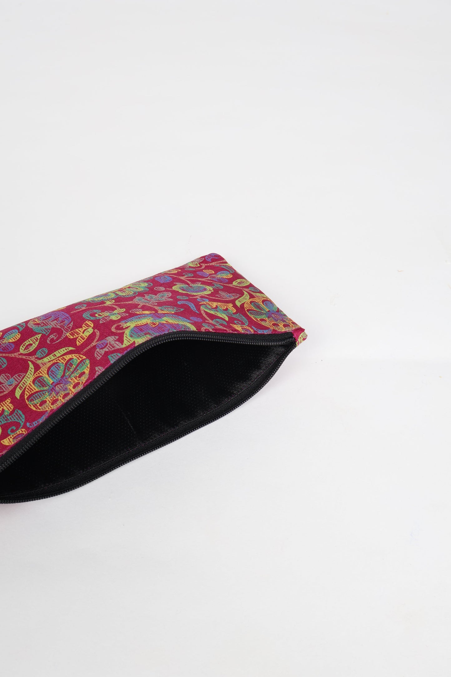 Eco-conscious quilted pencil pouch with waterproof lining made from upcycled garments, reflecting the values of circular fashion, carbon neutral fashion, and repurposed clothing. A perfect example of green fashion and sustainable women's clothing.