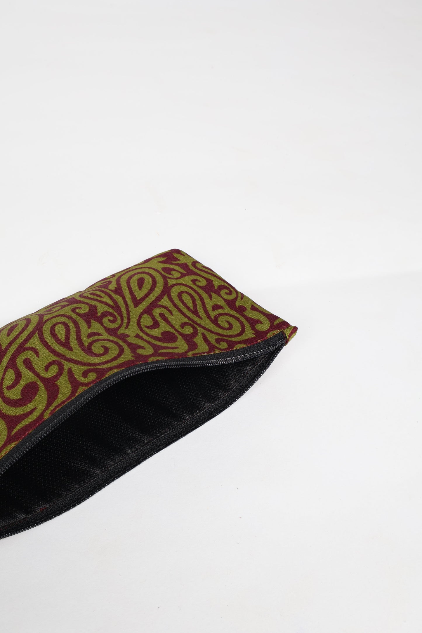 Eco-conscious quilted pencil pouch with waterproof lining made from upcycled garments, reflecting the values of circular fashion, carbon neutral fashion, and repurposed clothing. A perfect example of green fashion and sustainable women's clothing.