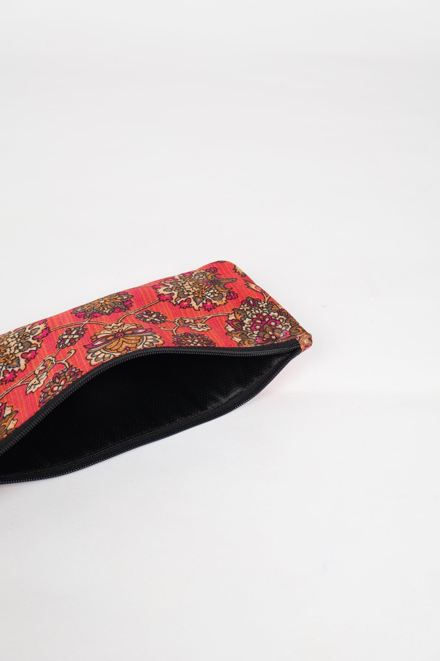 Eco-conscious quilted pencil pouch with waterproof lining made from upcycled garments, reflecting the values of circular fashion, carbon neutral fashion, and repurposed clothing. A perfect example of green fashion and sustainable women's clothing.