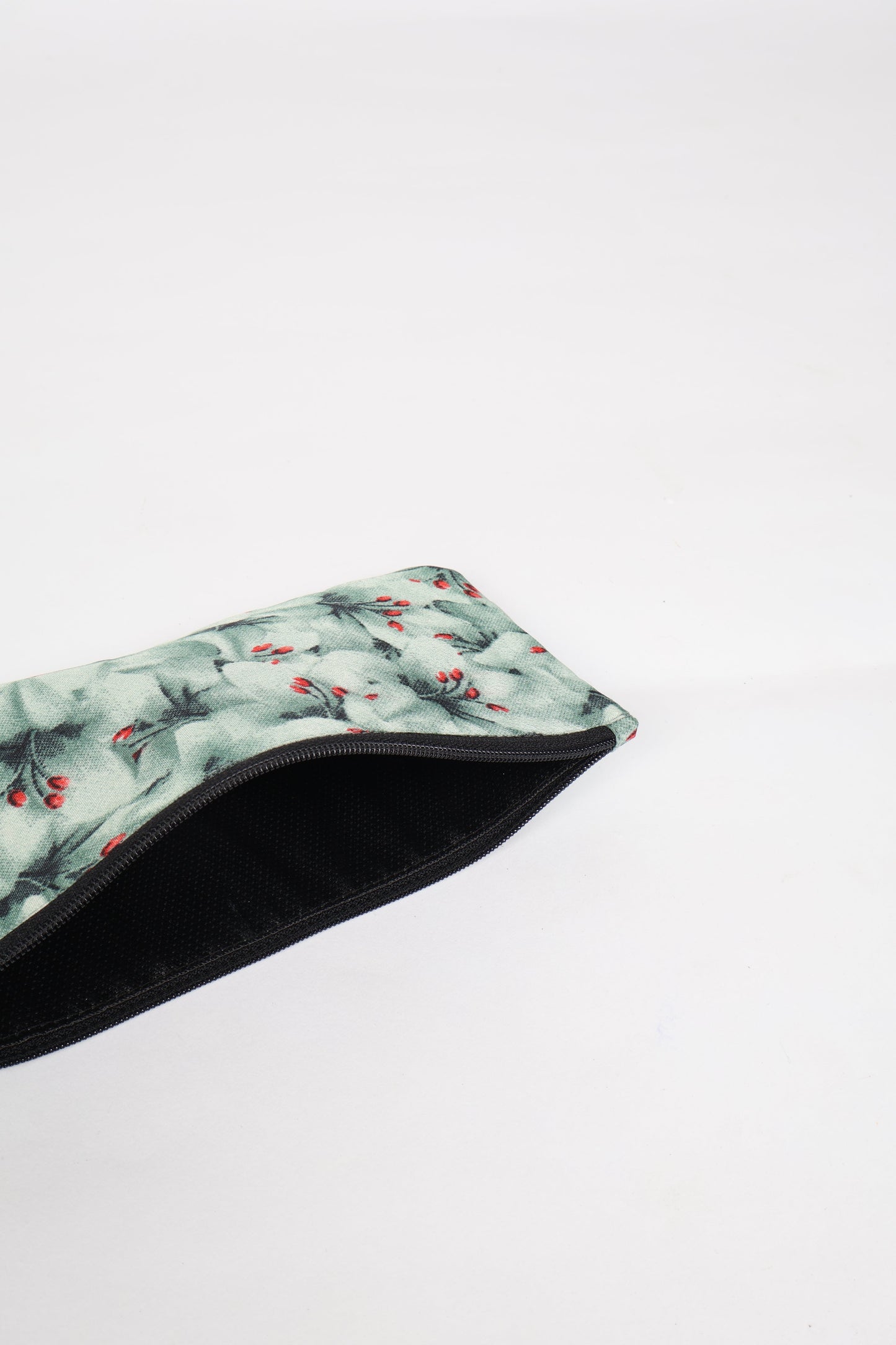 Eco-conscious quilted pencil pouch with waterproof lining made from upcycled garments, reflecting the values of circular fashion, carbon neutral fashion, and repurposed clothing. A perfect example of green fashion and sustainable women's clothing.