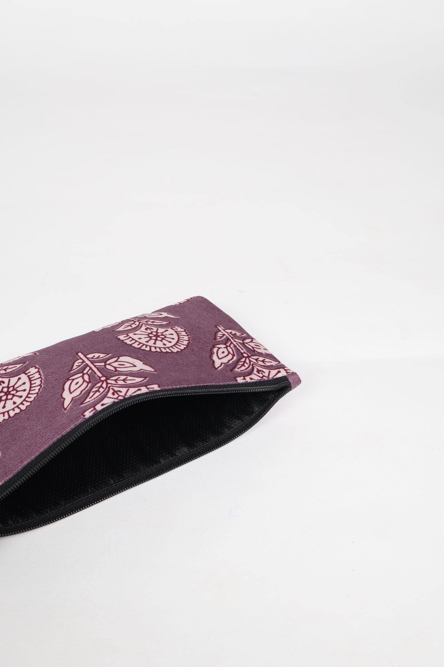 Eco-conscious quilted pencil pouch with waterproof lining made from upcycled garments, reflecting the values of circular fashion, carbon neutral fashion, and repurposed clothing. A perfect example of green fashion and sustainable women's clothing.