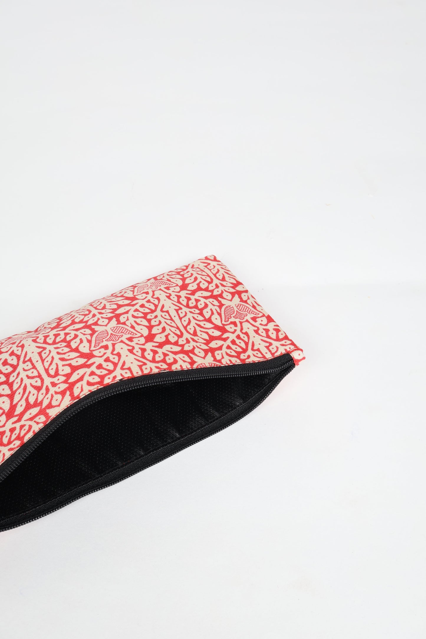 Eco-conscious quilted pencil pouch with waterproof lining made from upcycled garments, reflecting the values of circular fashion, carbon neutral fashion, and repurposed clothing. A perfect example of green fashion and sustainable women's clothing.