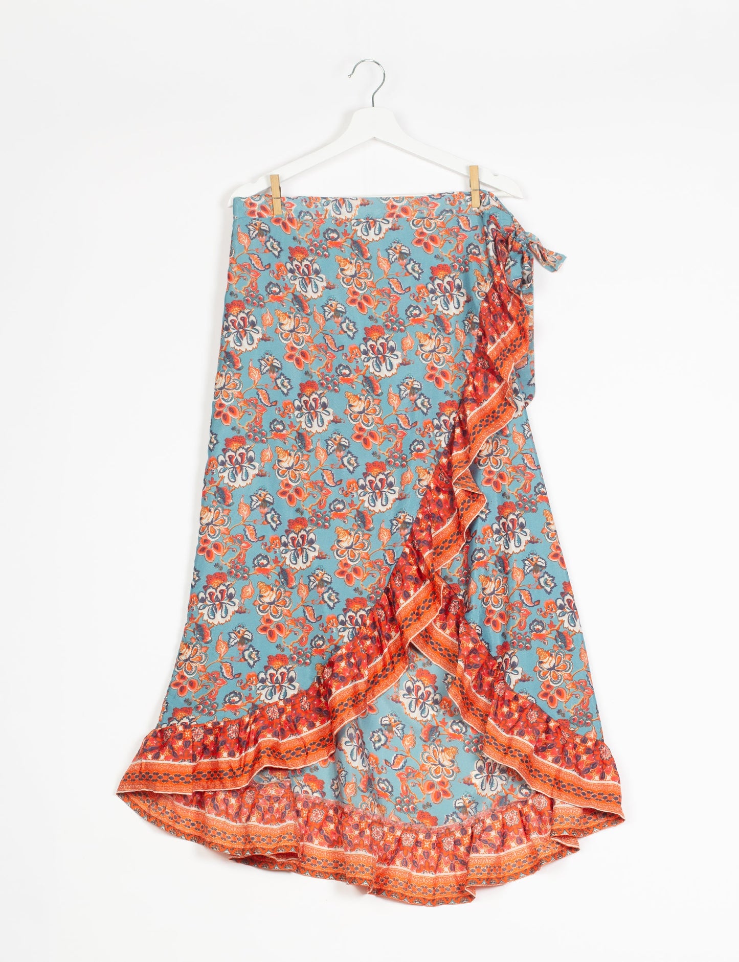 Frill Skirt Set made from recycled materials, highlighting sustainable fashion and fair trade practices. Features a ruffled wraparound skirt and a string-back top, symbolizing upcycled women's clothing and eco-friendly fashion.