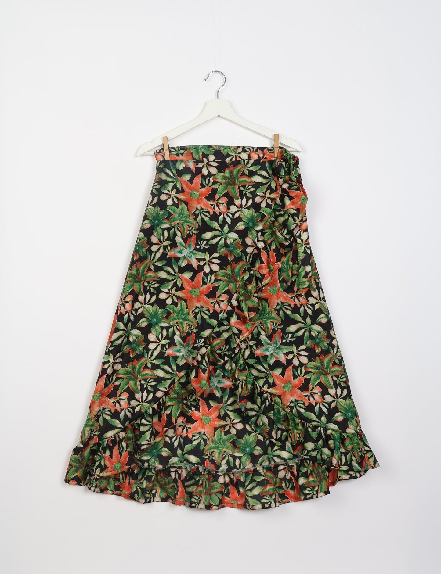 Frill Skirt Set made from recycled materials, highlighting sustainable fashion and fair trade practices. Features a ruffled wraparound skirt and a string-back top, symbolizing upcycled women's clothing and eco-friendly fashion.