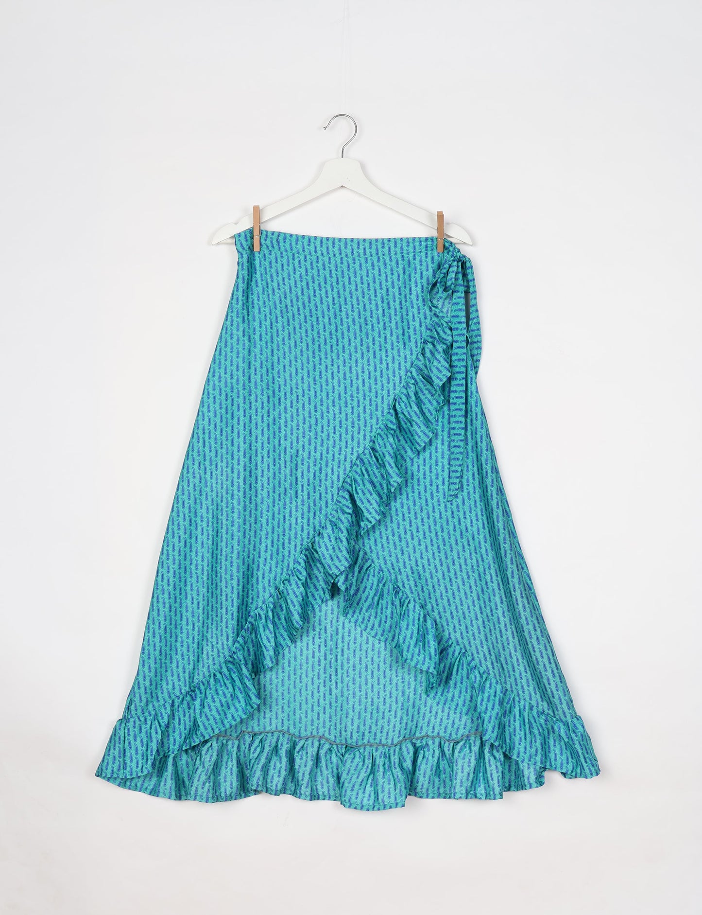 Frill Skirt Set made from recycled materials, highlighting sustainable fashion and fair trade practices. Features a ruffled wraparound skirt and a string-back top, symbolizing upcycled women's clothing and eco-friendly fashion.