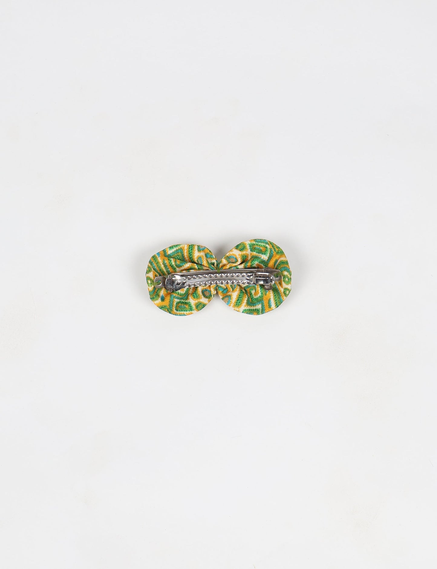 Stylish upcycled women's hairclip made from eco friendly products, reflecting the essence of upcycling fashion, ethical clothing, and sustainable apparel—ideal for those embracing slow fashion and earth friendly clothing.