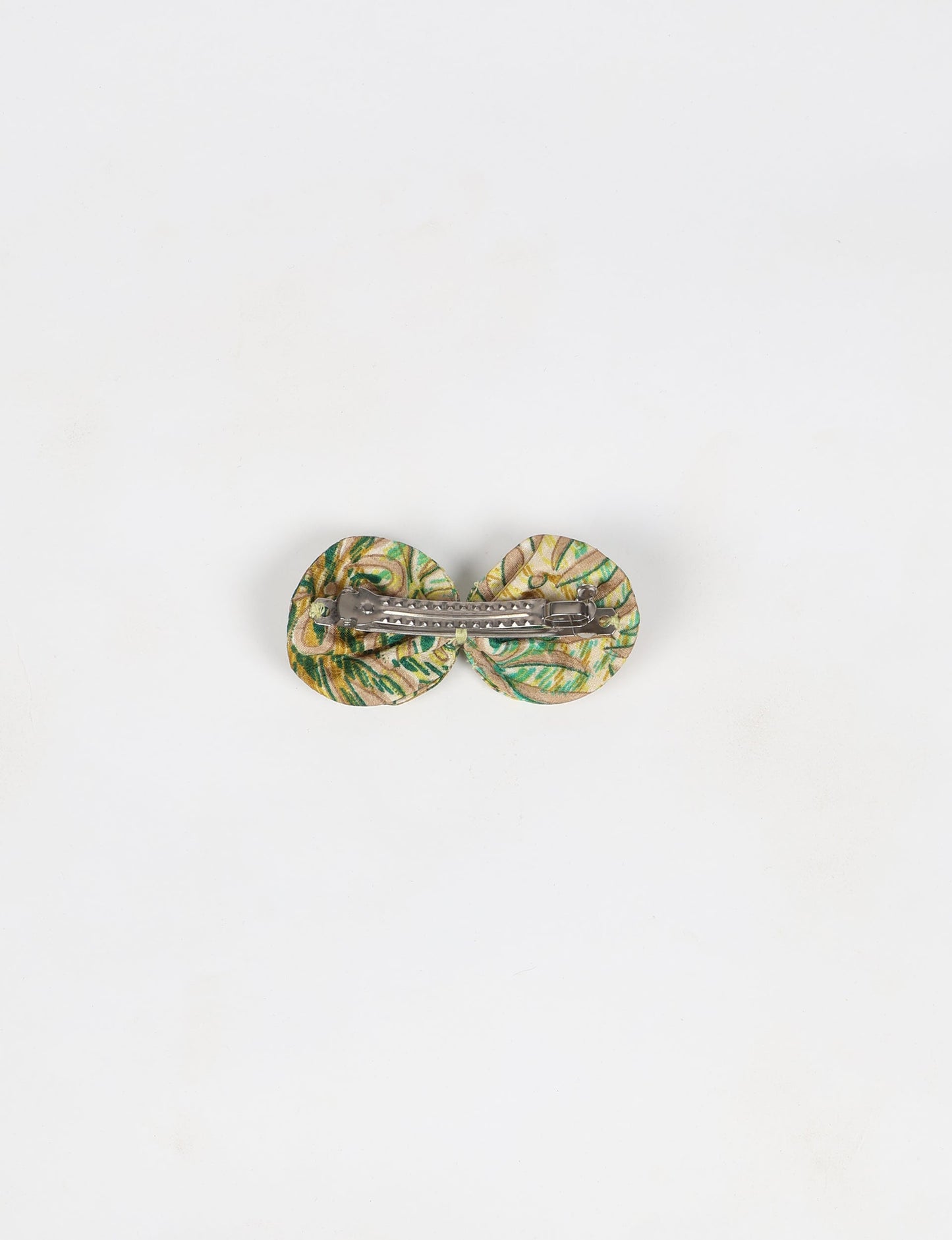Stylish upcycled women's hairclip made from eco friendly products, reflecting the essence of upcycling fashion, ethical clothing, and sustainable apparel—ideal for those embracing slow fashion and earth friendly clothing.