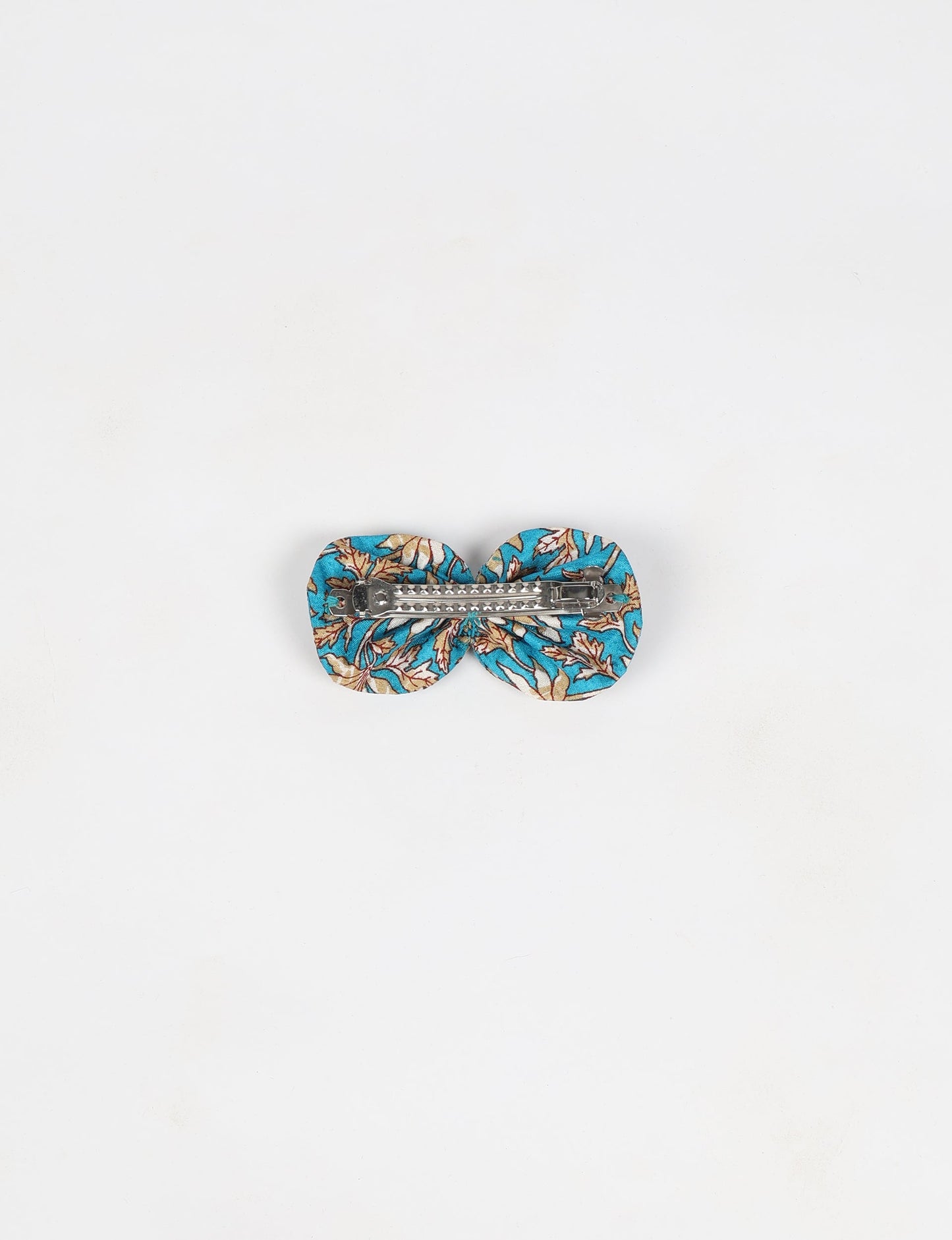 Stylish upcycled women's hairclip made from eco friendly products, reflecting the essence of upcycling fashion, ethical clothing, and sustainable apparel—ideal for those embracing slow fashion and earth friendly clothing.