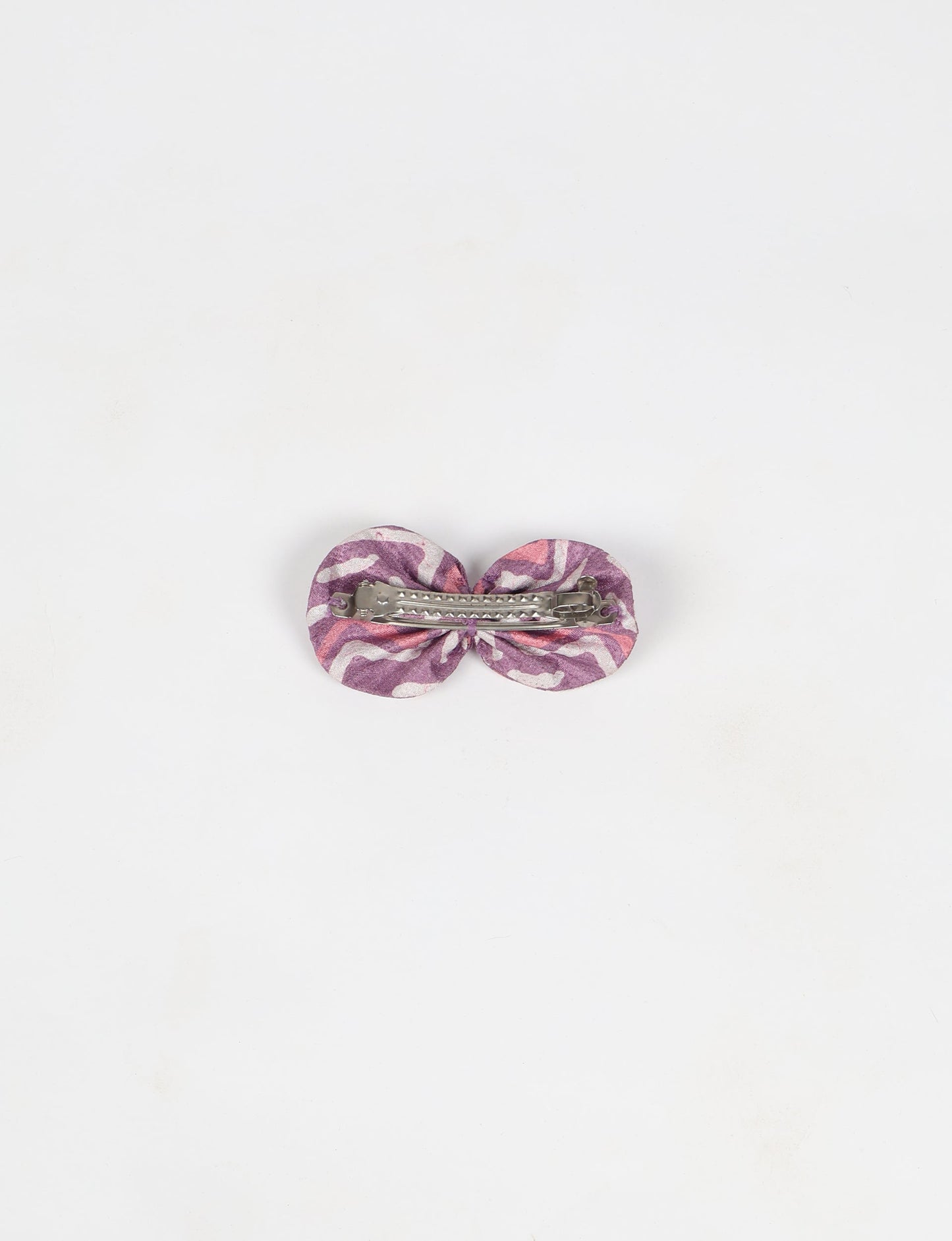 Stylish upcycled women's hairclip made from eco friendly products, reflecting the essence of upcycling fashion, ethical clothing, and sustainable apparel—ideal for those embracing slow fashion and earth friendly clothing.