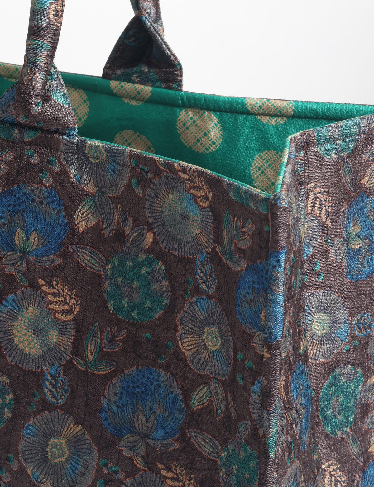 Grey floral fabric work tote bag with blue and beige flowers, teal interior lining with beige polka dots, and fabric handles