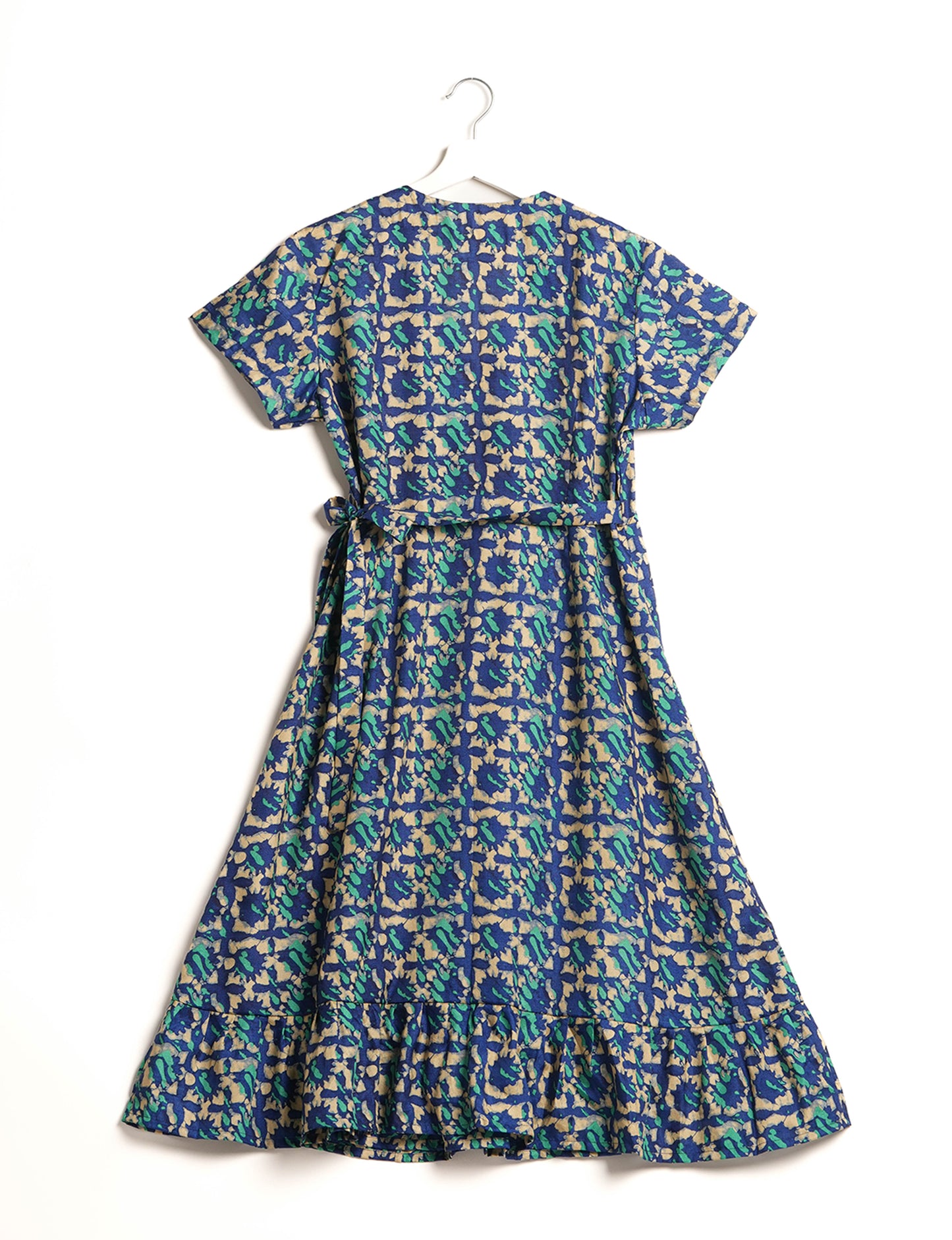 Embrace timeless elegance with our MIDI WRAP DRESS – a midi-length beauty featuring a v-neck, flattery from all angles, and a charming sari belt. Crafted from sustainable materials, this dress embodies ethical clothing and green fashion. Sophisticated with a frill tier at the hem and short cap sleeves, this dress is perfect for any occasion. Tie up the beautifully crafted sari belt on the side for a versatile, stylish, and eco-friendly look.