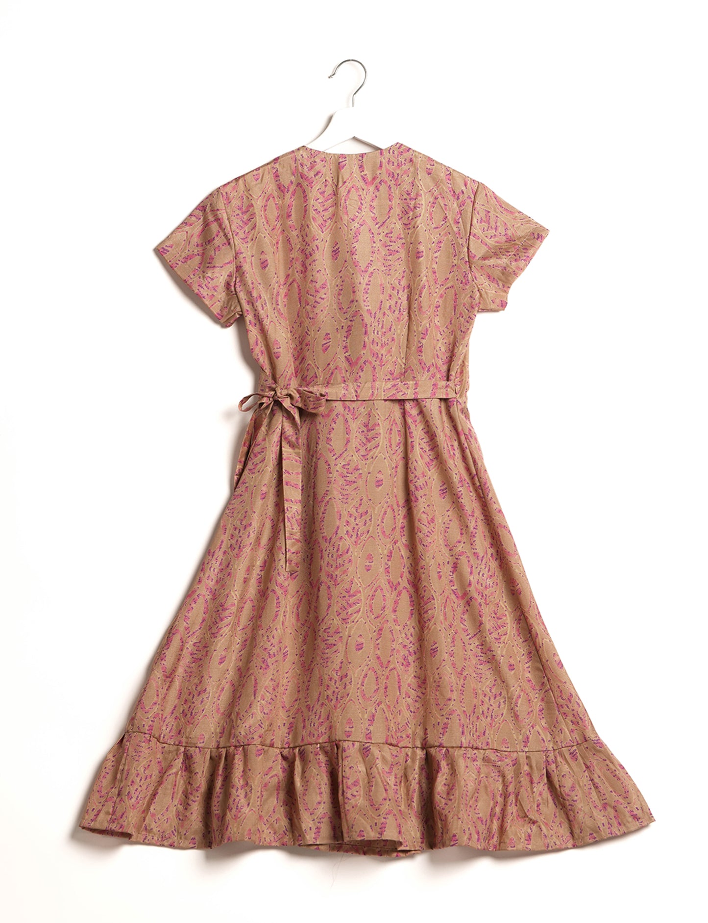 Embrace timeless elegance with our MIDI WRAP DRESS – a midi-length beauty featuring a v-neck, flattery from all angles, and a charming sari belt. Crafted from sustainable materials, this dress embodies ethical clothing and green fashion. Sophisticated with a frill tier at the hem and short cap sleeves, this dress is perfect for any occasion. Tie up the beautifully crafted sari belt on the side for a versatile, stylish, and eco-friendly look.