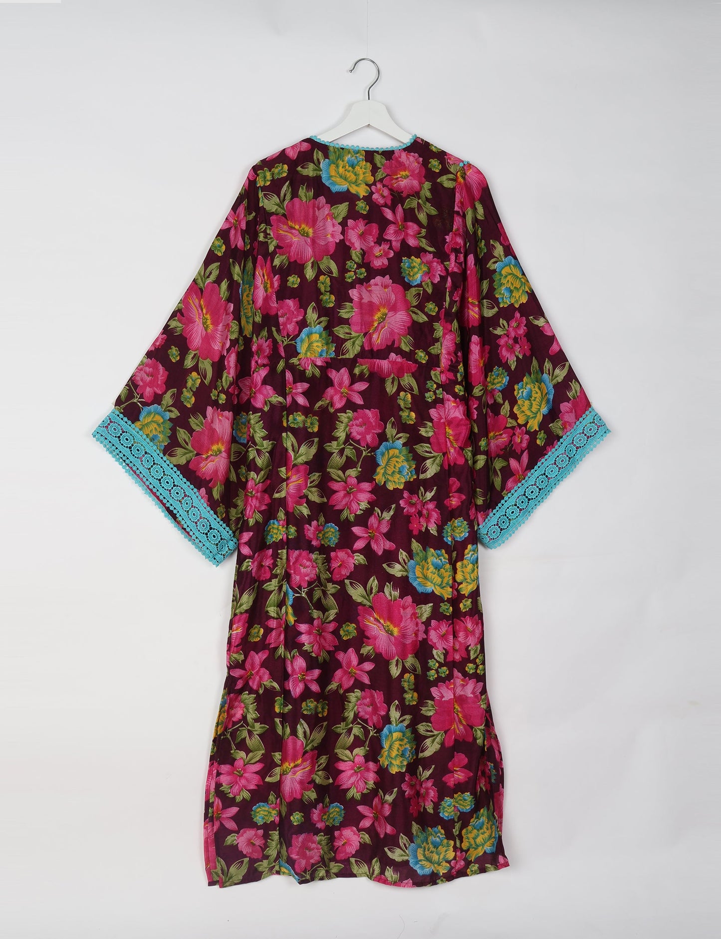 Maxi Kaftan with cotton lace on sleeves and midriff, featuring a tie-up neckline with tassels. Ankle-length, eco-friendly fashion made from recycled materials, offering sustainable women’s clothing for a chic, earth-friendly wardrobe.