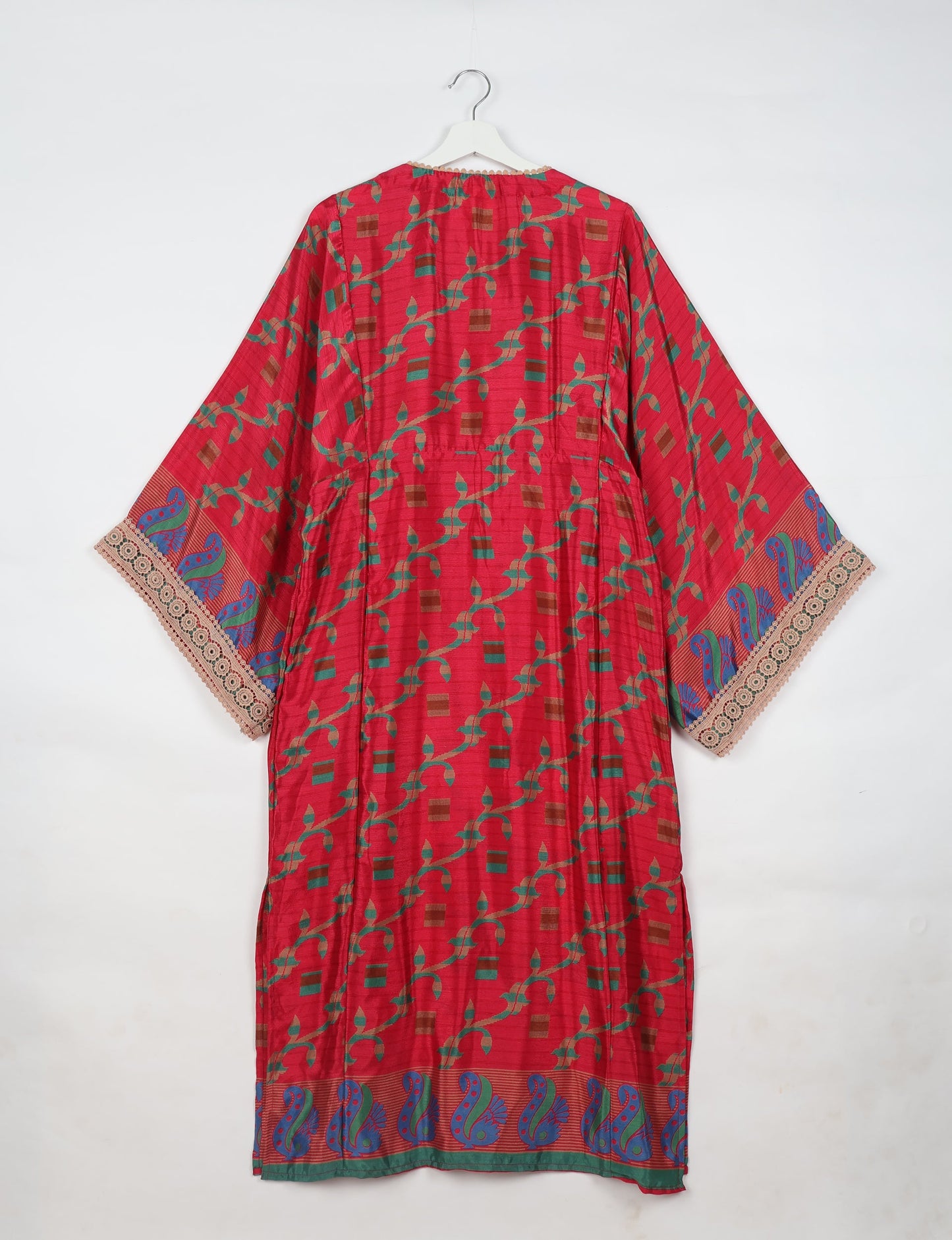 Maxi Kaftan with cotton lace on sleeves and midriff, featuring a tie-up neckline with tassels. Ankle-length, eco-friendly fashion made from recycled materials, offering sustainable women’s clothing for a chic, earth-friendly wardrobe.