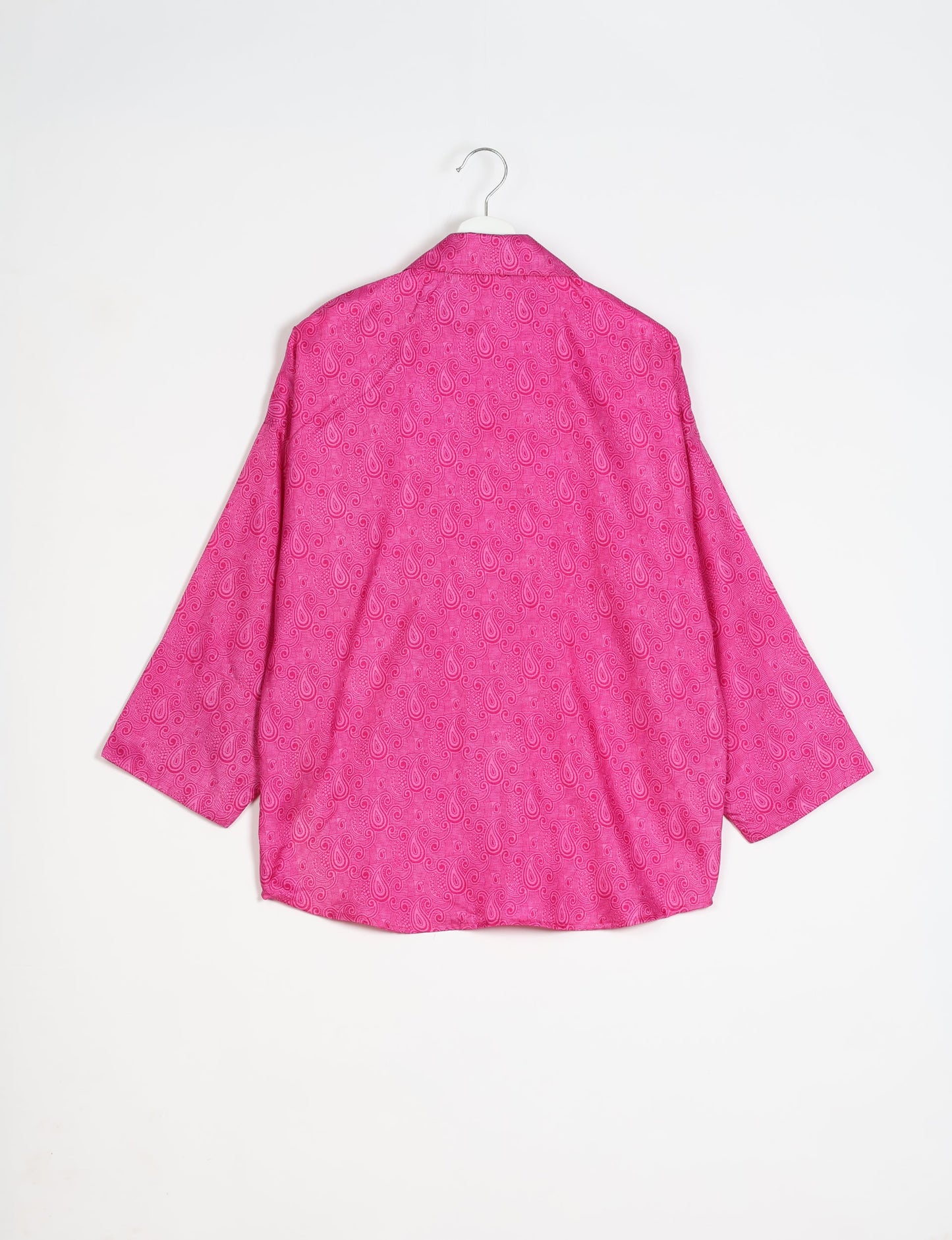 Experience chic comfort with our OVERSIZED SHIRT ā a one-of-a-kind piece crafted from sari waste by talented Indian female artisans. With 3/4 length sleeves, a regular shirt collar, and a contrasting inner collar band, this shirt is perfect for work or casual hangouts. Versatile and stylish, it pairs effortlessly over a shift dress, jumpsuit, or with pants.