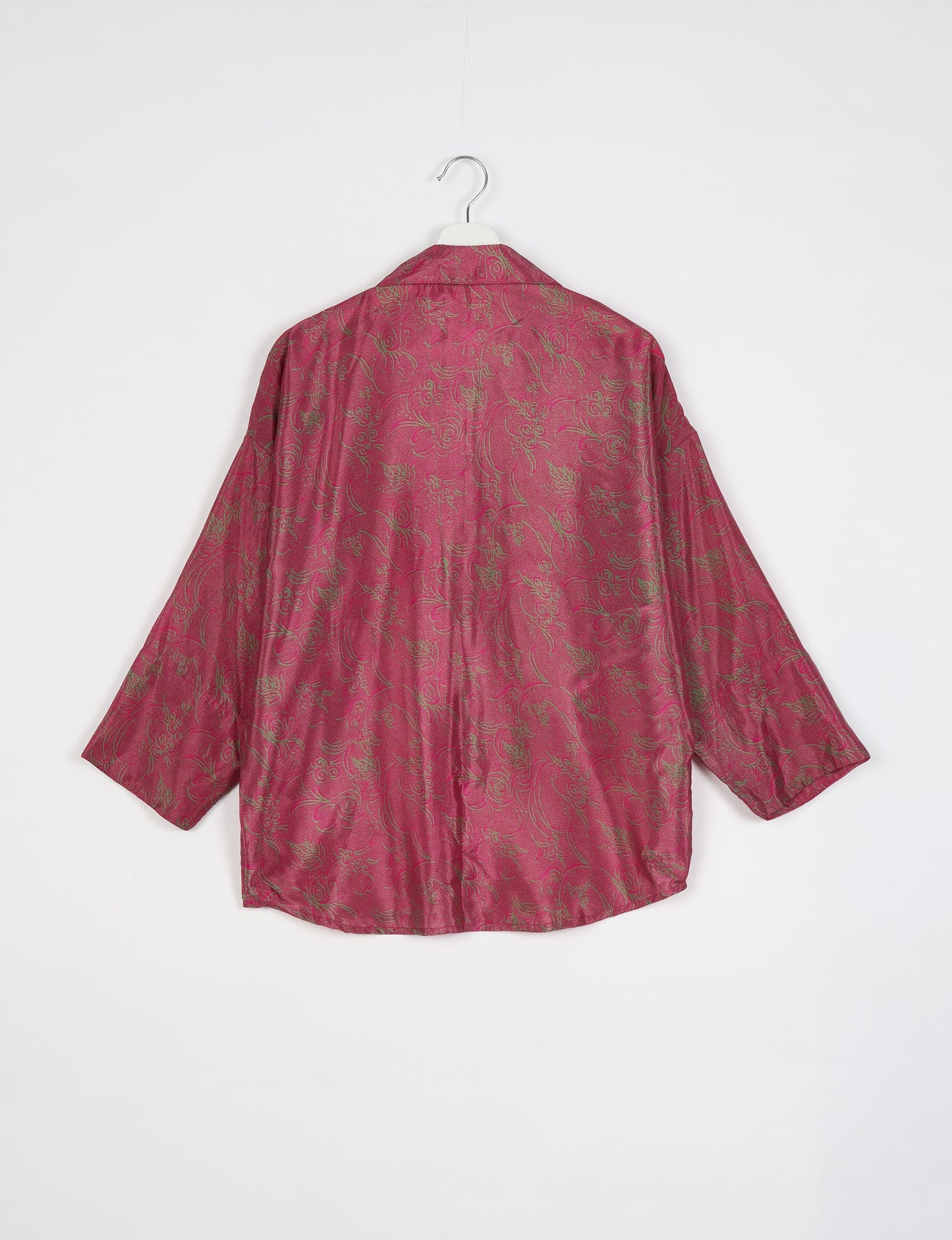 Experience chic comfort with our OVERSIZED SHIRT – a one-of-a-kind piece crafted from sari waste by talented Indian female artisans. With 3/4 length sleeves, a regular shirt collar, and a contrasting inner collar band, this shirt is perfect for work or casual hangouts. Versatile and stylish, it pairs effortlessly over a shift dress, jumpsuit, or with pants.