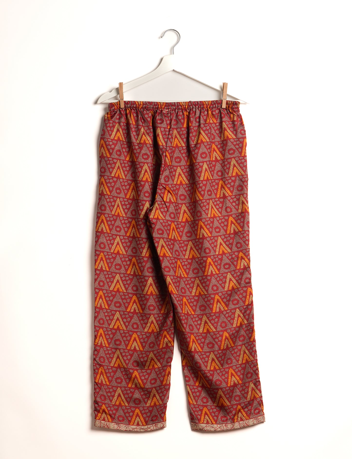 Elevate your wardrobe with our planet-friendly PULL-ON PANTS. Made from upcycled sari fabric, these eco-conscious pants offer a drawstring waist for a perfect fit. Tapered leg design ensures both style and comfort. Choose ethical, green fashion that supports artisans and sustainable living.