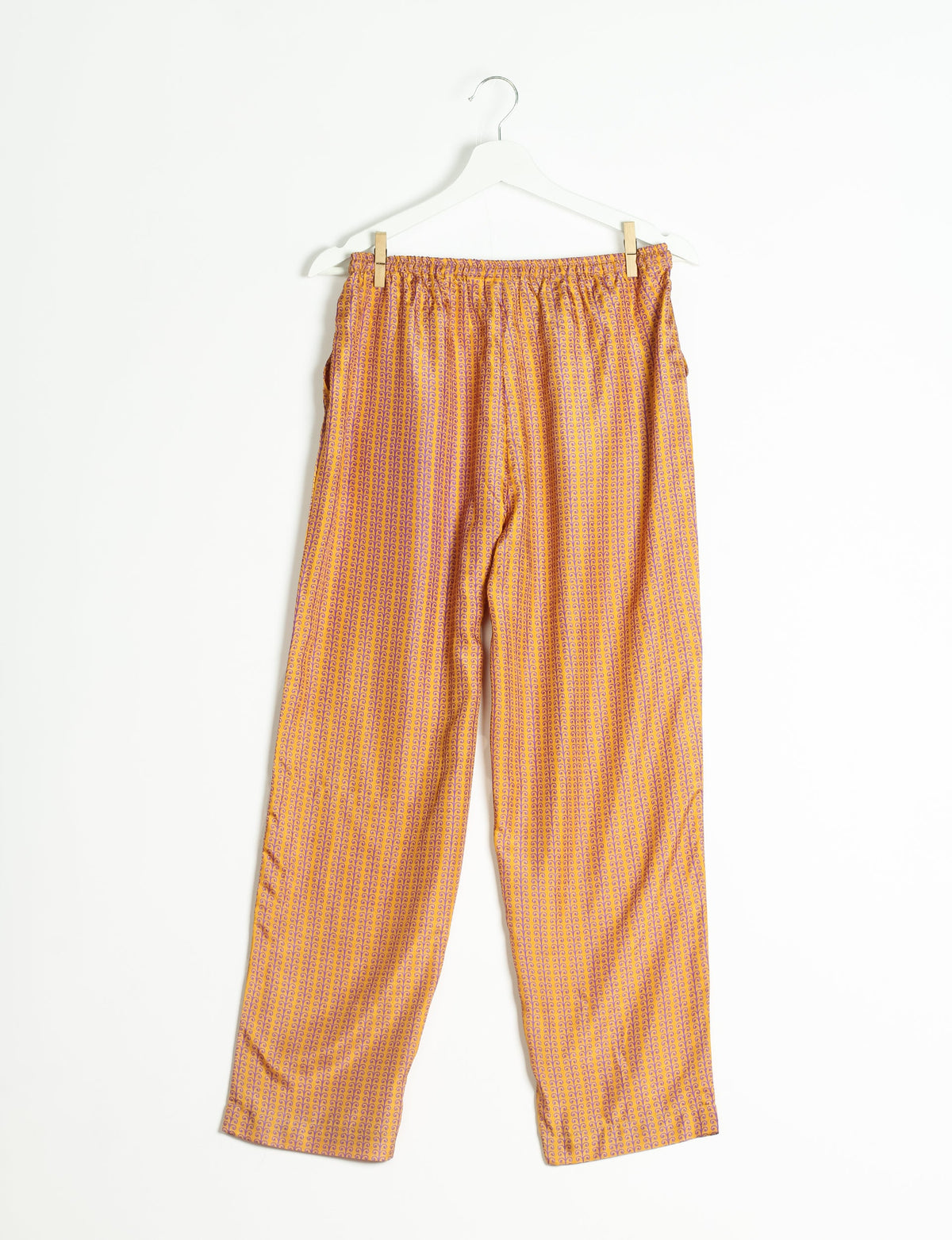 Elevate your wardrobe with our planet-friendly PULL-ON PANTS. Made from upcycled sari fabric, these eco-conscious pants offer a drawstring waist for a perfect fit. Tapered leg design ensures both style and comfort. Choose ethical, green fashion that supports artisans and sustainable living.