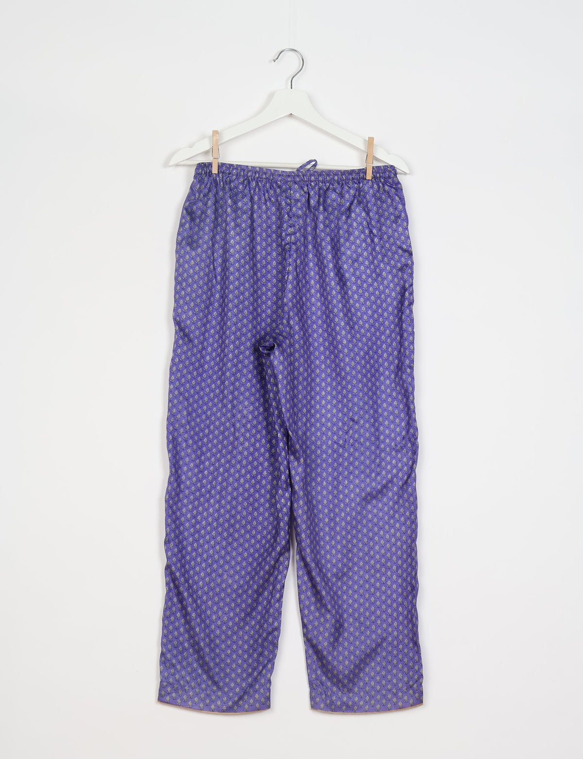Elevate your wardrobe with our planet-friendly PULL-ON PANTS. Made from upcycled sari fabric, these eco-conscious pants offer a drawstring waist for a perfect fit. Tapered leg design ensures both style and comfort. Choose ethical, green fashion that supports artisans and sustainable living.