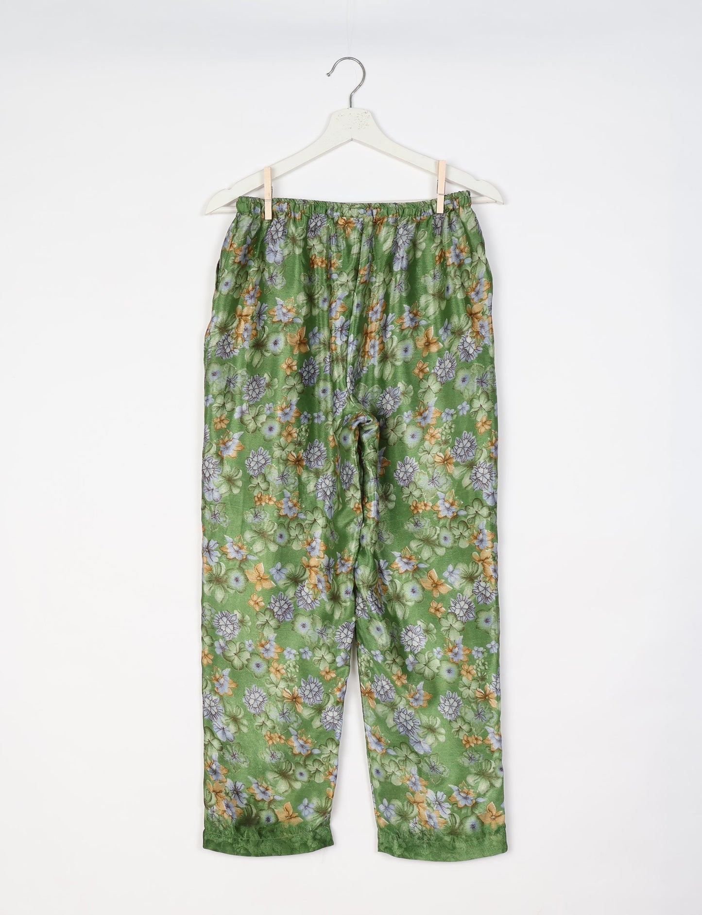 Elevate your wardrobe with our planet-friendly PULL-ON PANTS. Made from upcycled sari fabric, these eco-conscious pants offer a drawstring waist for a perfect fit. Tapered leg design ensures both style and comfort. Choose ethical, green fashion that supports artisans and sustainable living.