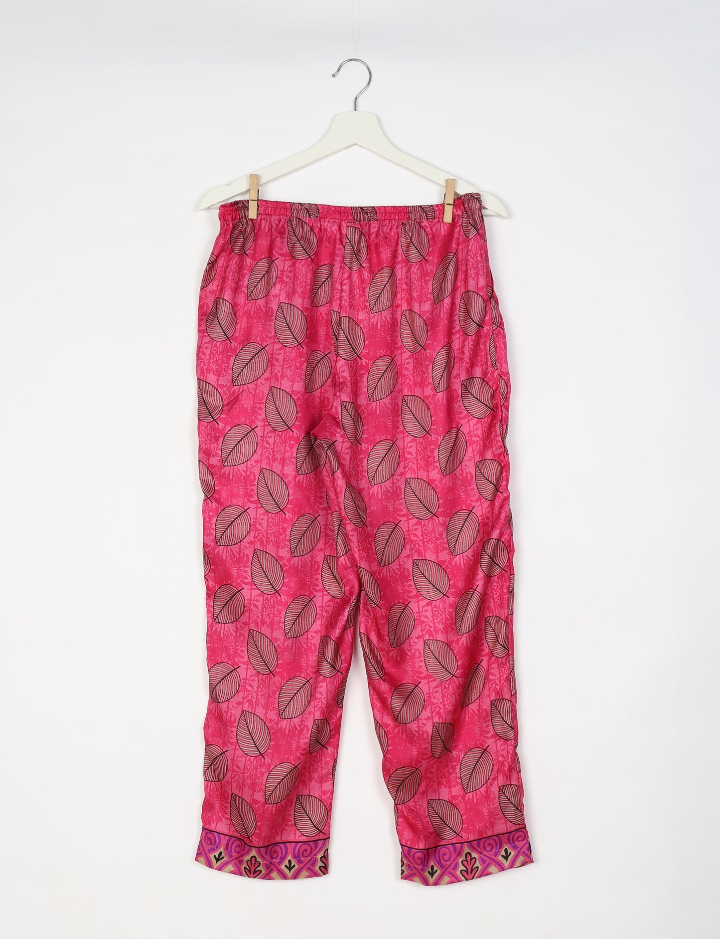 Elevate your wardrobe with our planet-friendly PULL-ON PANTS. Made from upcycled sari fabric, these eco-conscious pants offer a drawstring waist for a perfect fit. Tapered leg design ensures both style and comfort. Choose ethical, green fashion that supports artisans and sustainable living.