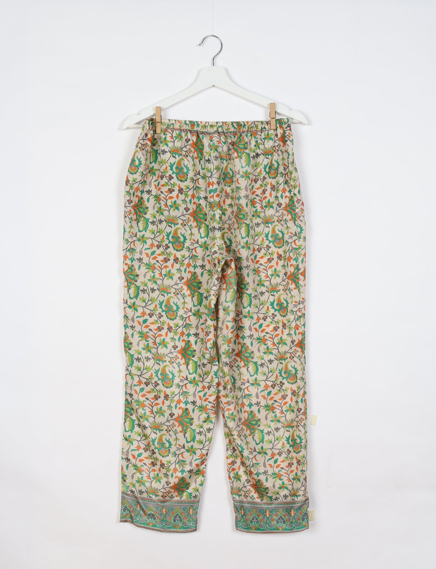 Elevate your wardrobe with our planet-friendly PULL-ON PANTS. Made from upcycled sari fabric, these eco-conscious pants offer a drawstring waist for a perfect fit. Tapered leg design ensures both style and comfort. Choose ethical, green fashion that supports artisans and sustainable living.