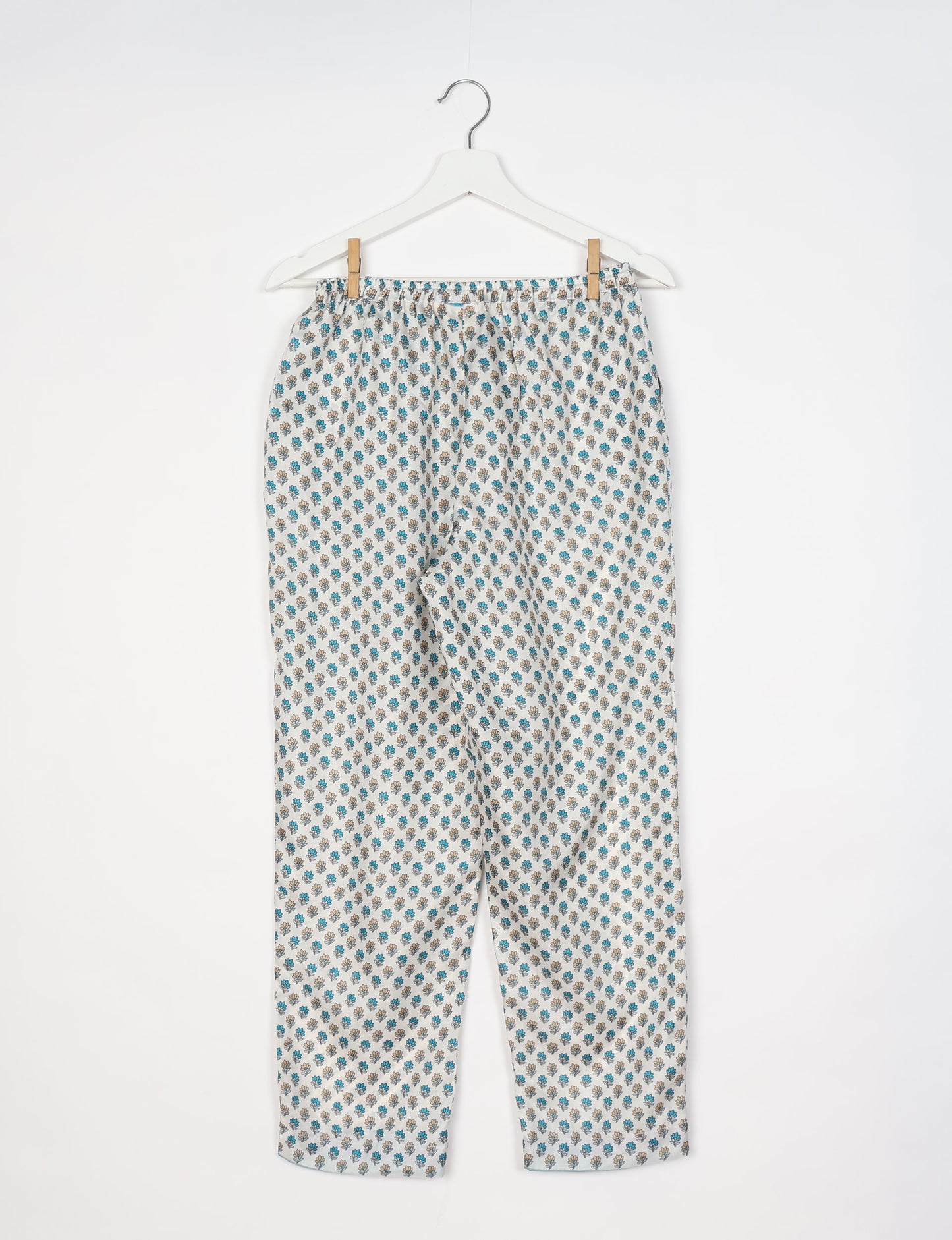 Elevate your wardrobe with our planet-friendly PULL-ON PANTS. Made from upcycled sari fabric, these eco-conscious pants offer a drawstring waist for a perfect fit. Tapered leg design ensures both style and comfort. Choose ethical, green fashion that supports artisans and sustainable living.