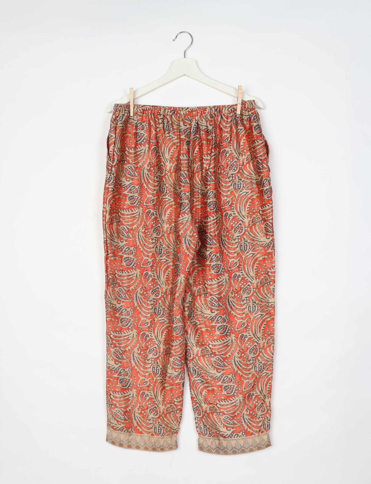 Elevate your wardrobe with our planet-friendly PULL-ON PANTS. Made from upcycled sari fabric, these eco-conscious pants offer a drawstring waist for a perfect fit. Tapered leg design ensures both style and comfort. Choose ethical, green fashion that supports artisans and sustainable living.