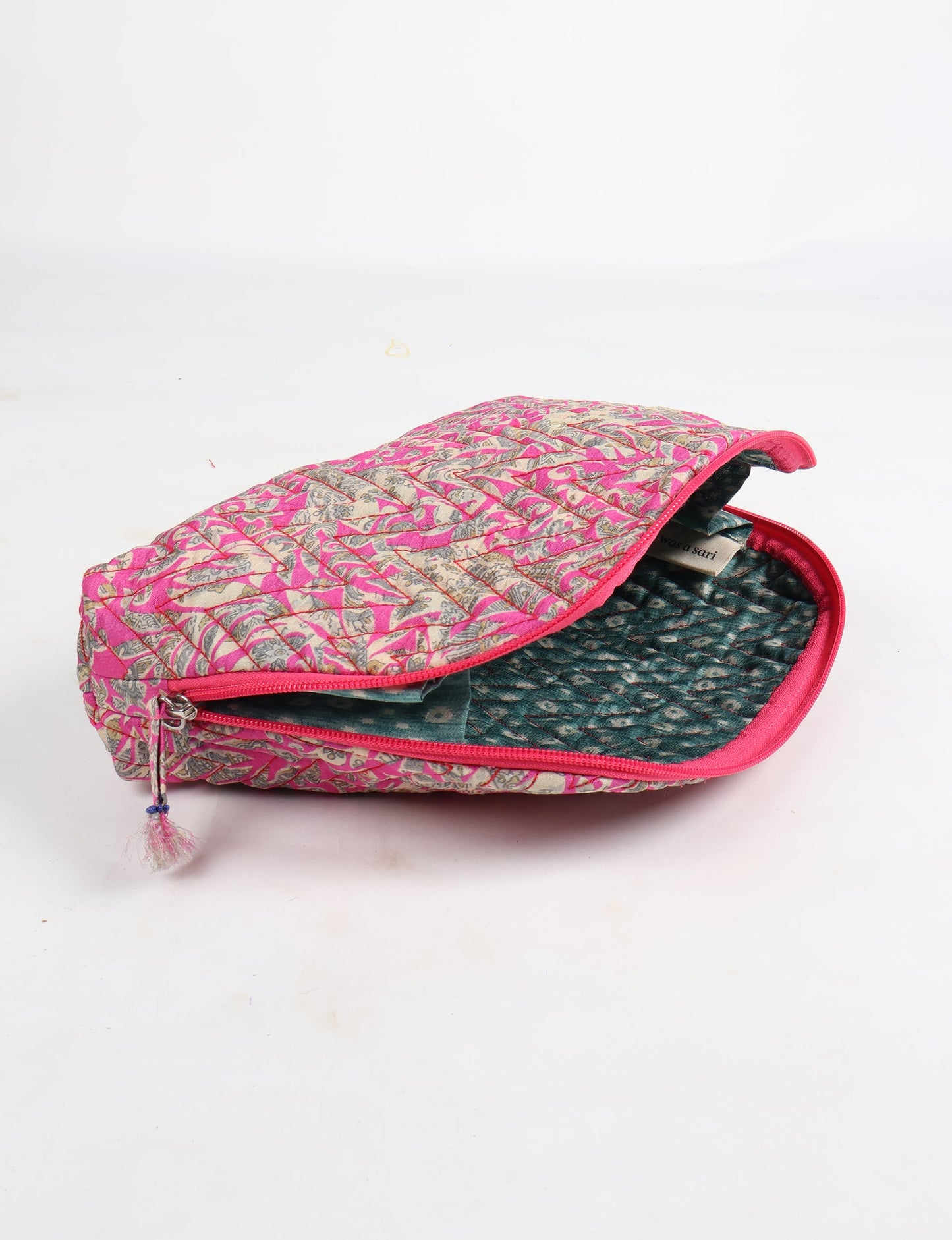 A set of two Vanity Pouches, featuring embellished beaded pullers, made from sustainable materials for eco-conscious travelers.