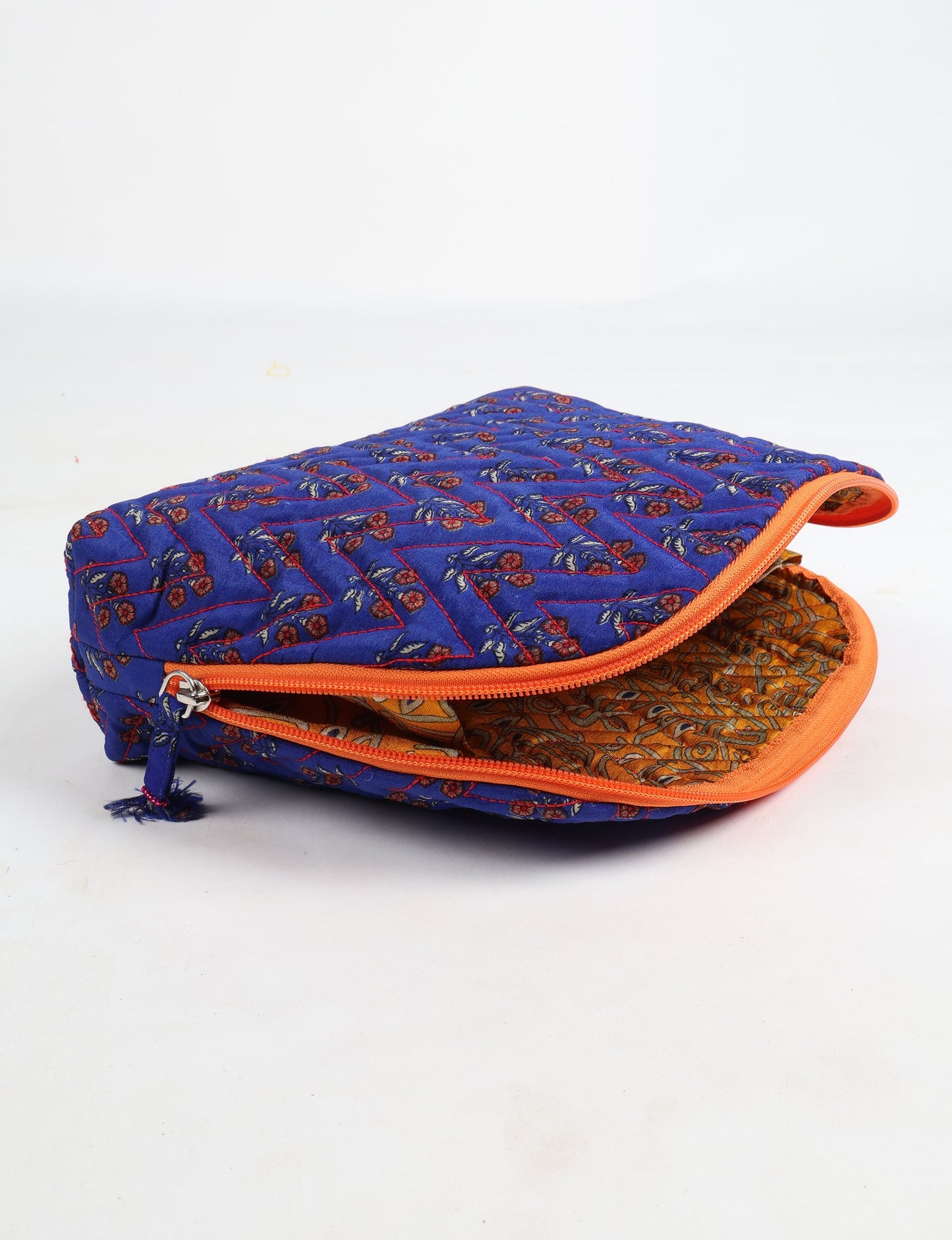 A set of two Vanity Pouches, featuring embellished beaded pullers, made from sustainable materials for eco-conscious travelers.