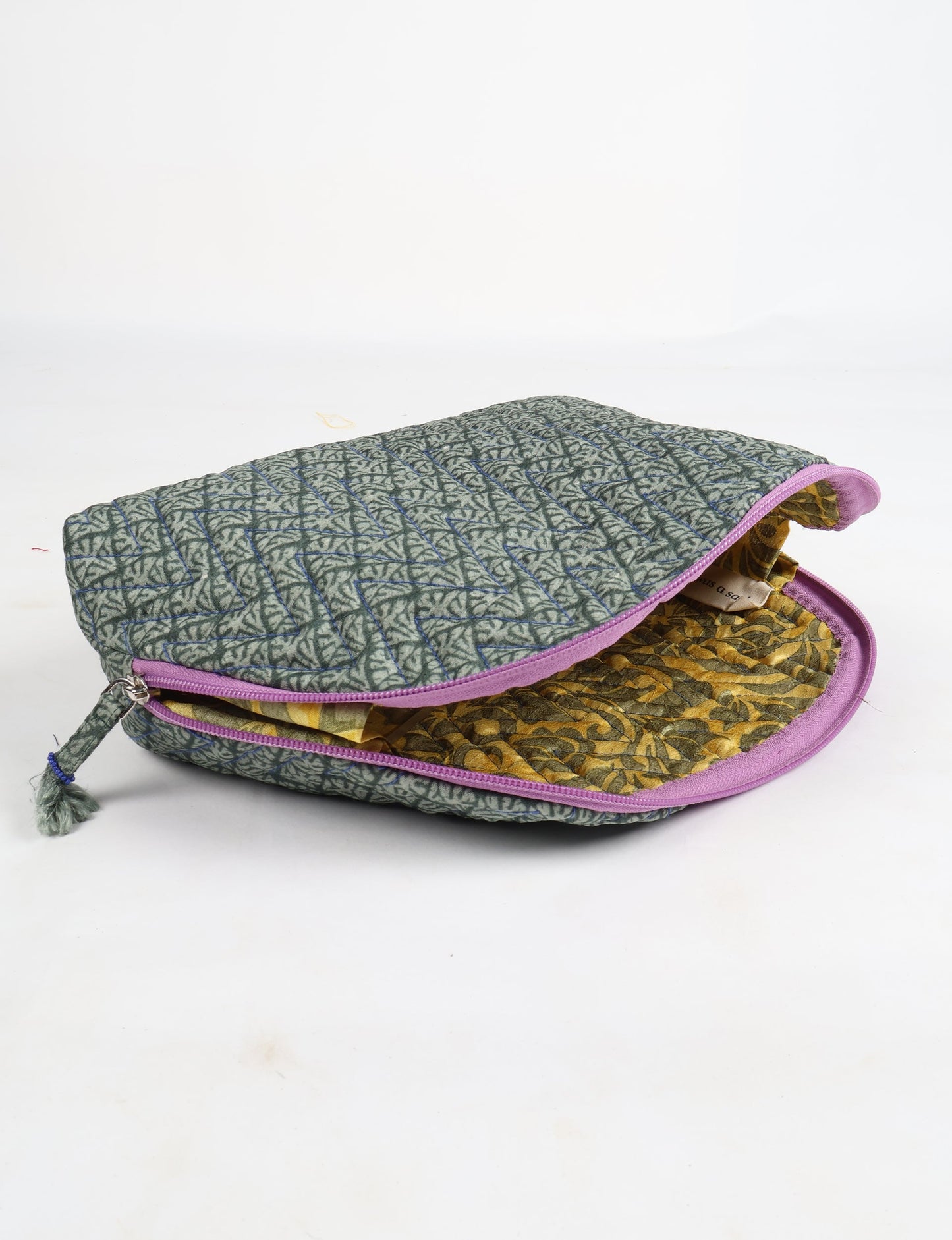 A set of two Vanity Pouches, featuring embellished beaded pullers, made from sustainable materials for eco-conscious travelers.