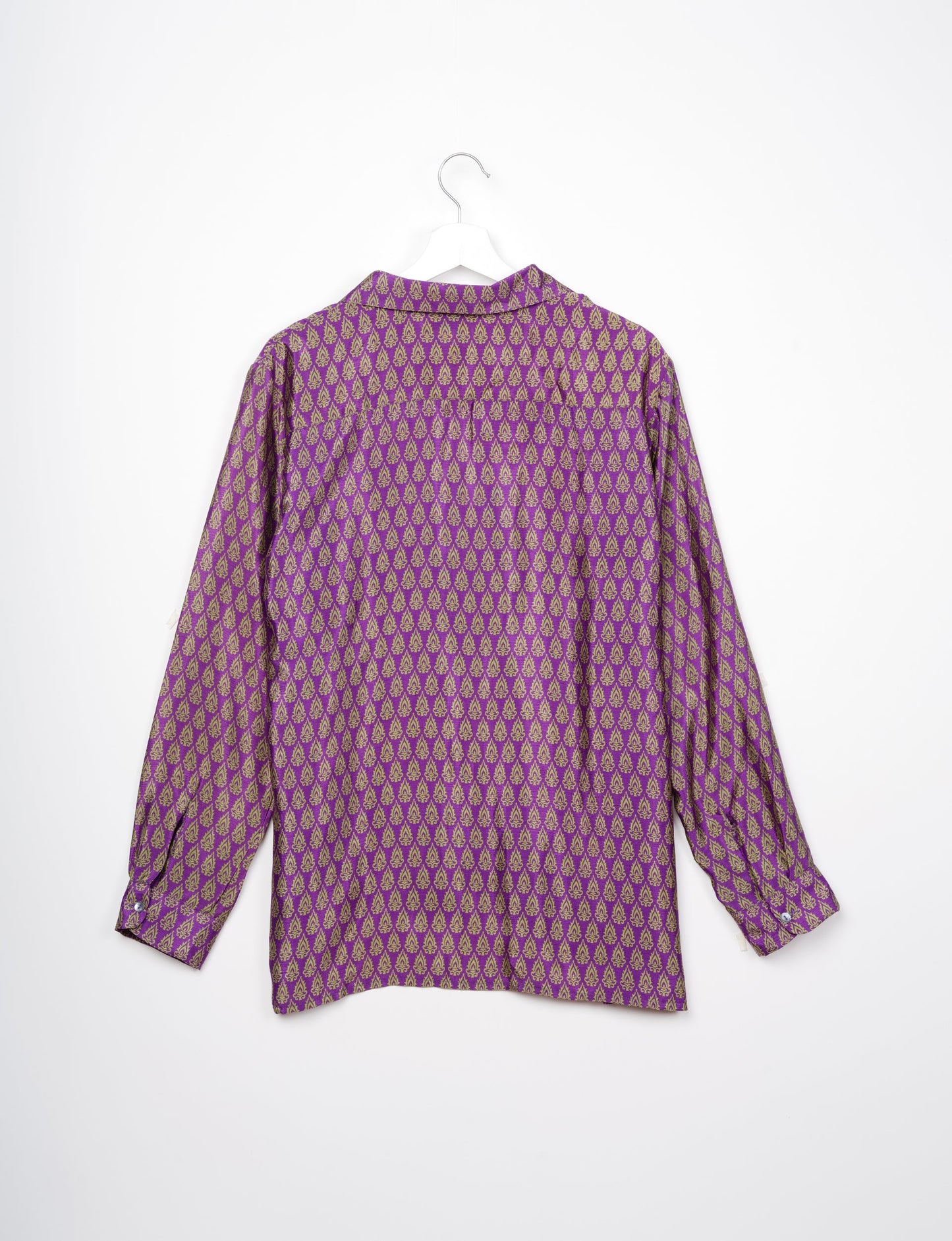 A person wearing a Resort Shirt, a sustainable fashion choice made from recycled materials.