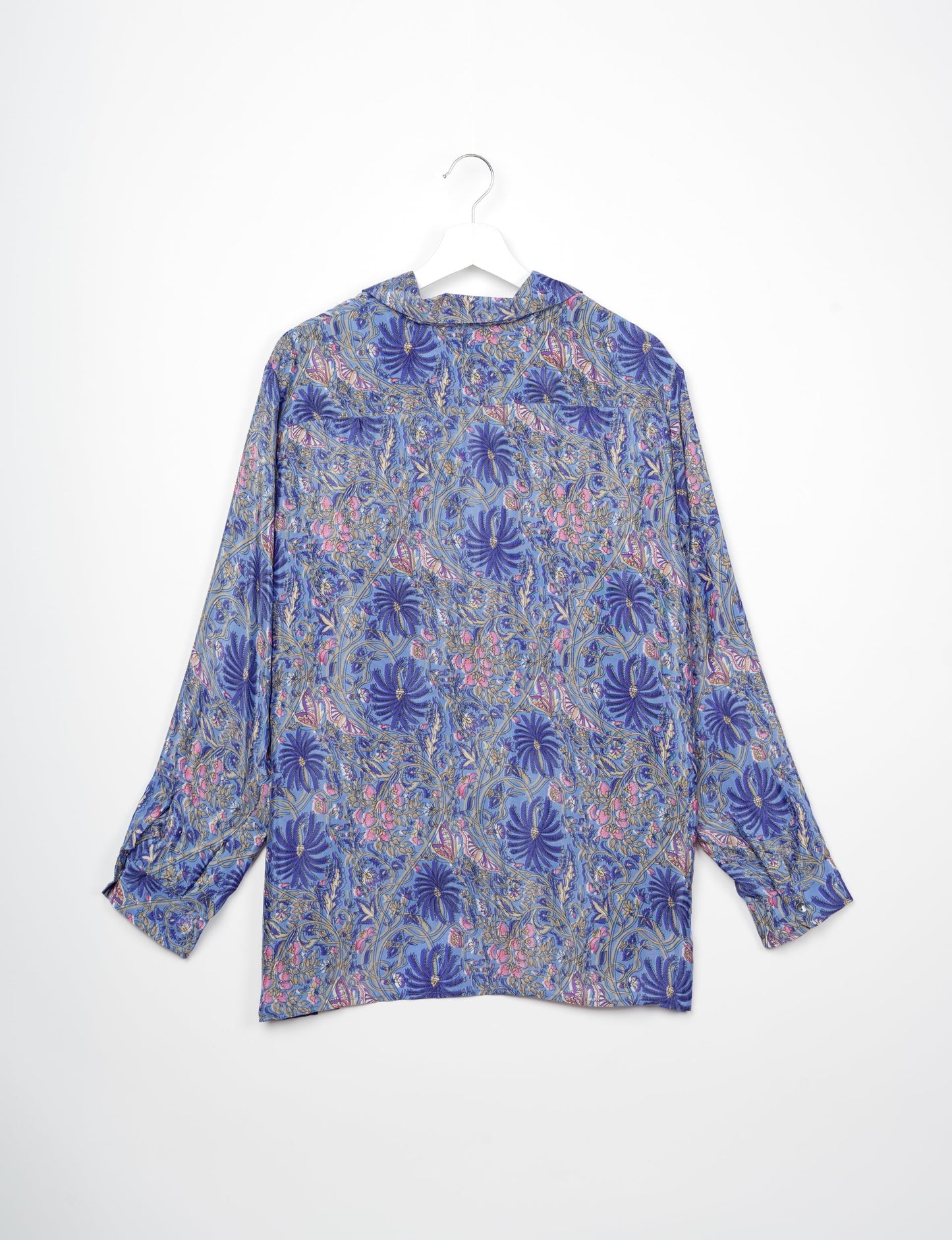 A person wearing a Resort Shirt, a sustainable fashion choice made from recycled materials.