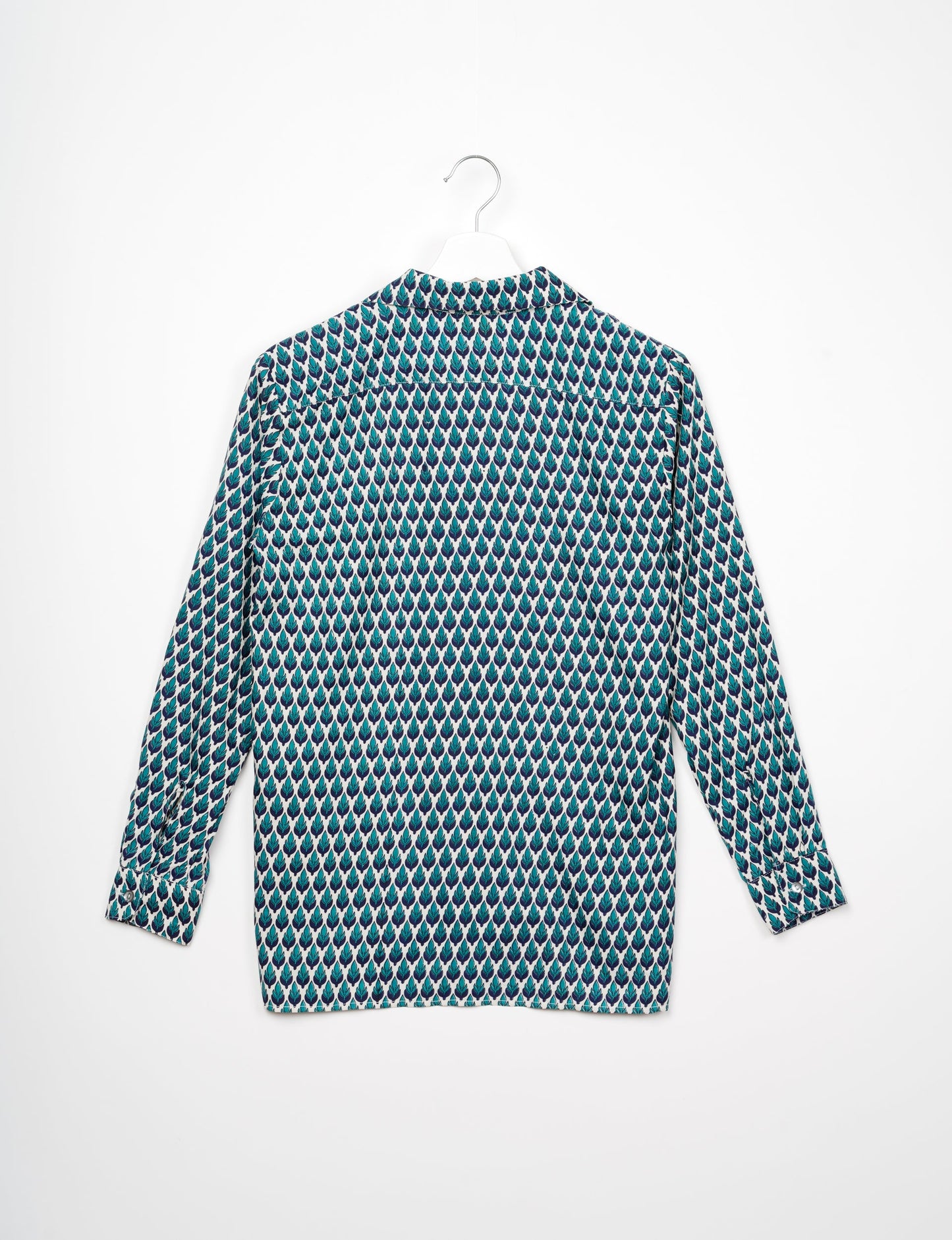 A person wearing a Resort Shirt, a sustainable fashion choice made from recycled materials.