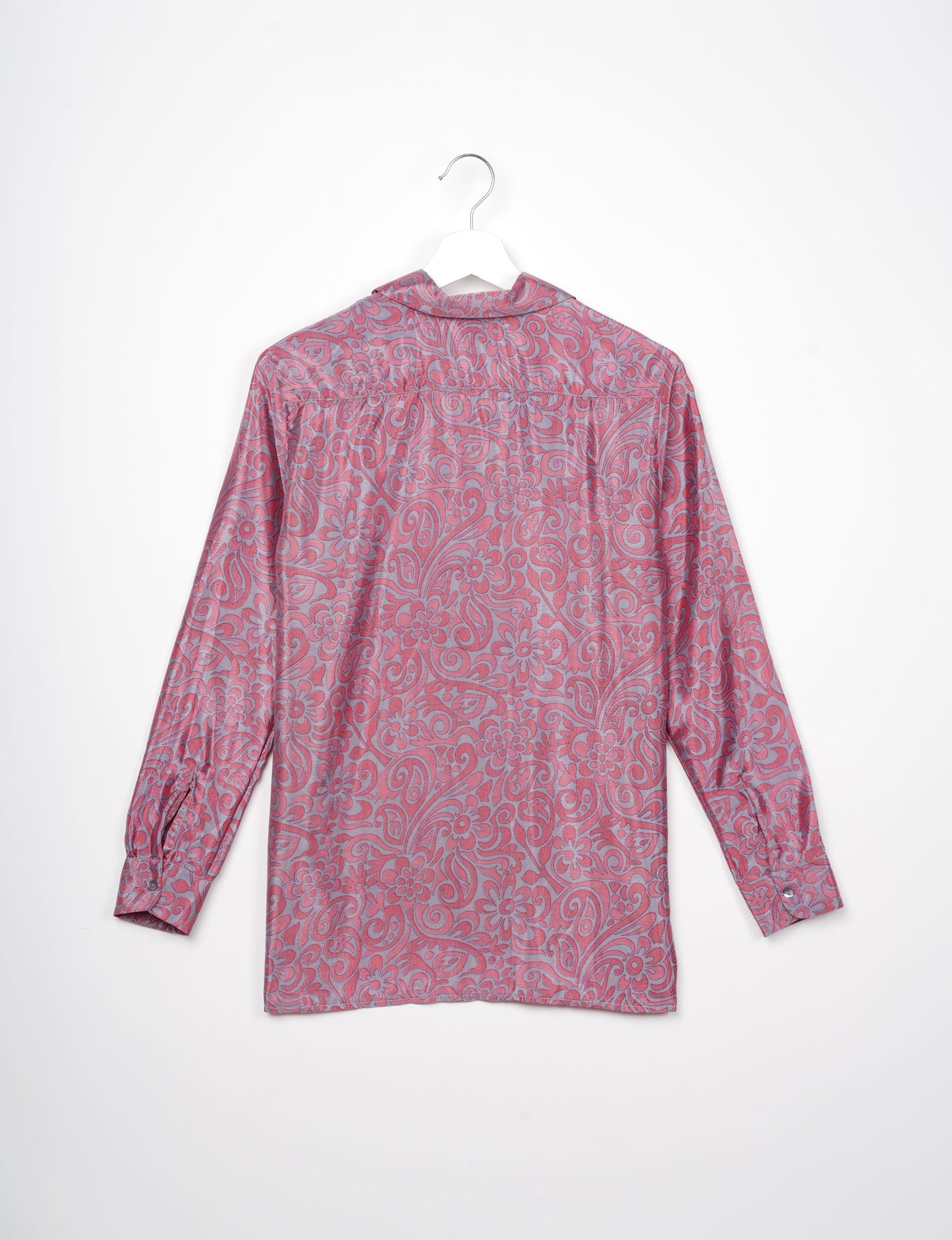 A person wearing a Resort Shirt, a sustainable fashion choice made from recycled materials.