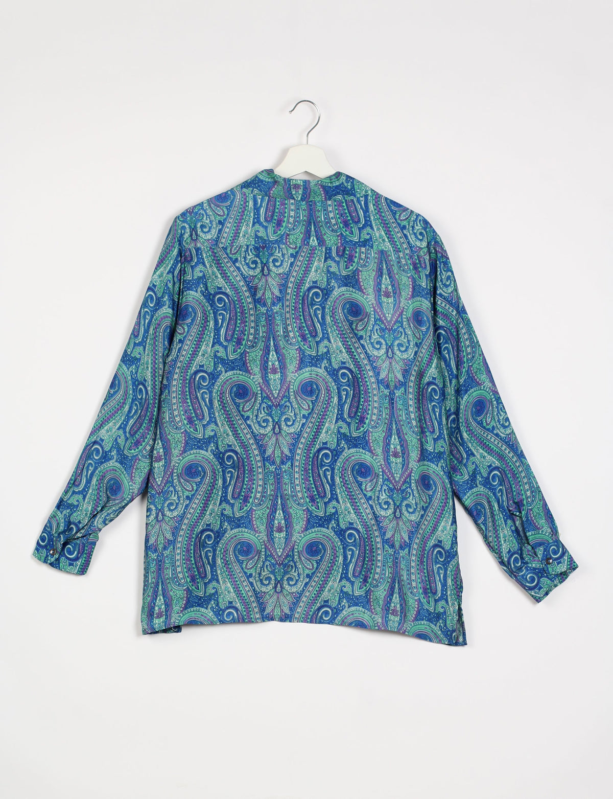 A person wearing a Resort Shirt, a sustainable fashion choice made from recycled materials.
