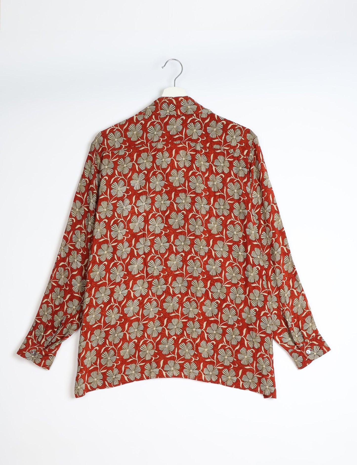 A person wearing a Resort Shirt, a sustainable fashion choice made from recycled materials.