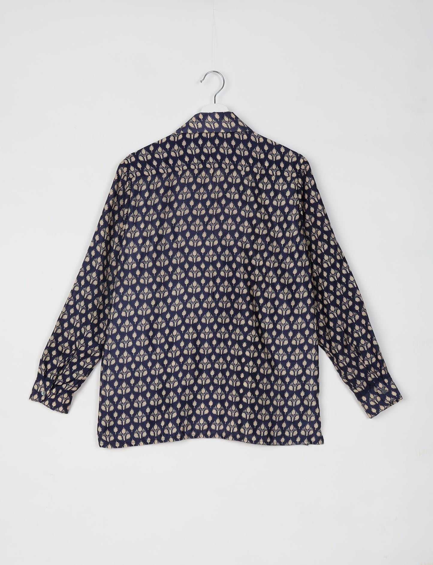 A person wearing a Resort Shirt, a sustainable fashion choice made from recycled materials.