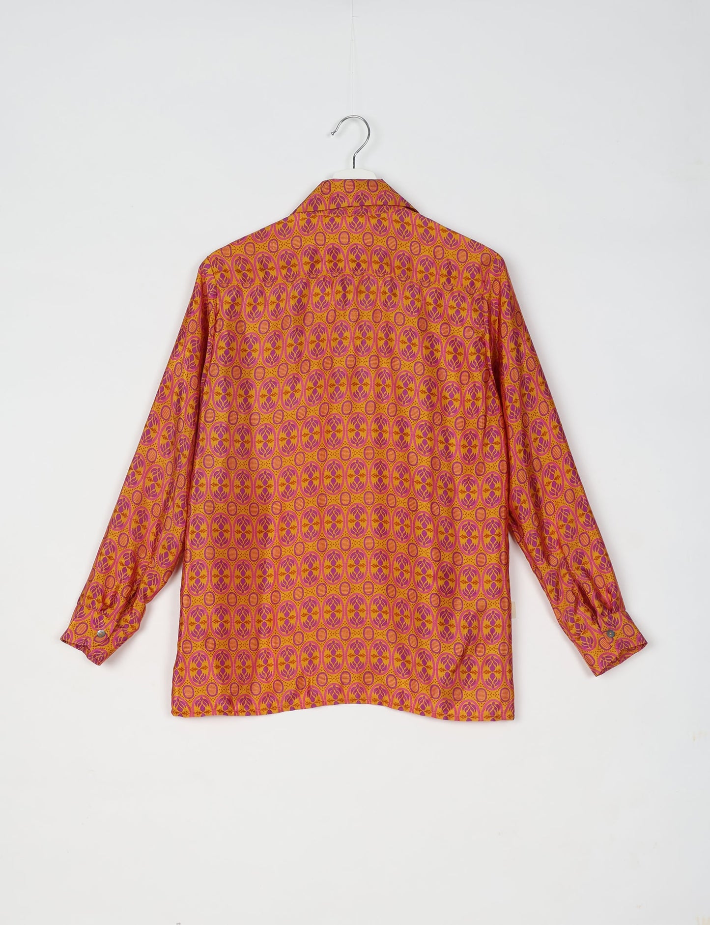 A person wearing a Resort Shirt, a sustainable fashion choice made from recycled materials.