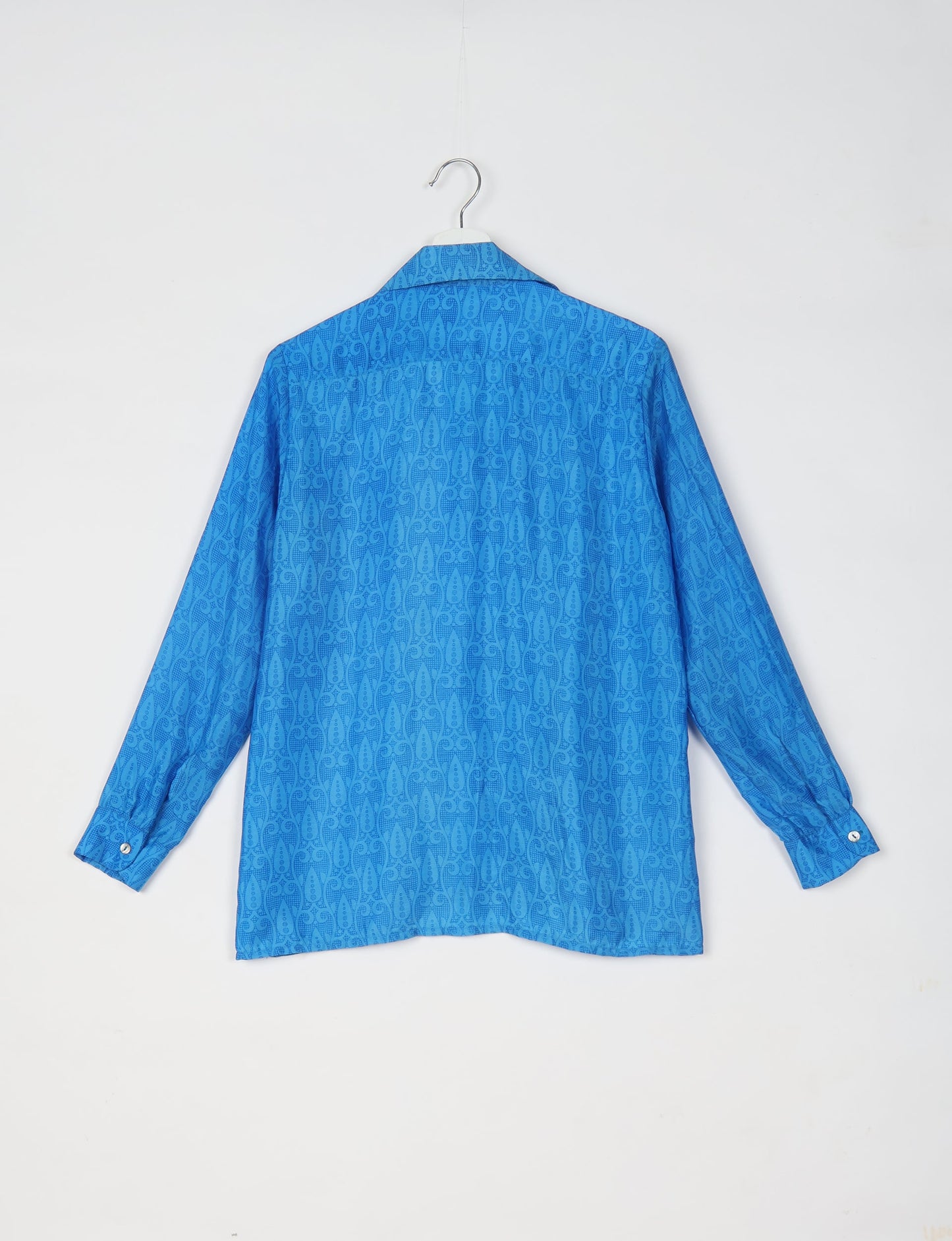 A person wearing a Resort Shirt, a sustainable fashion choice made from recycled materials.