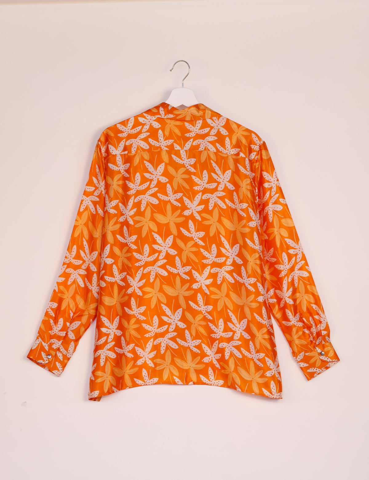 A person wearing a Resort Shirt, a sustainable fashion choice made from recycled materials.