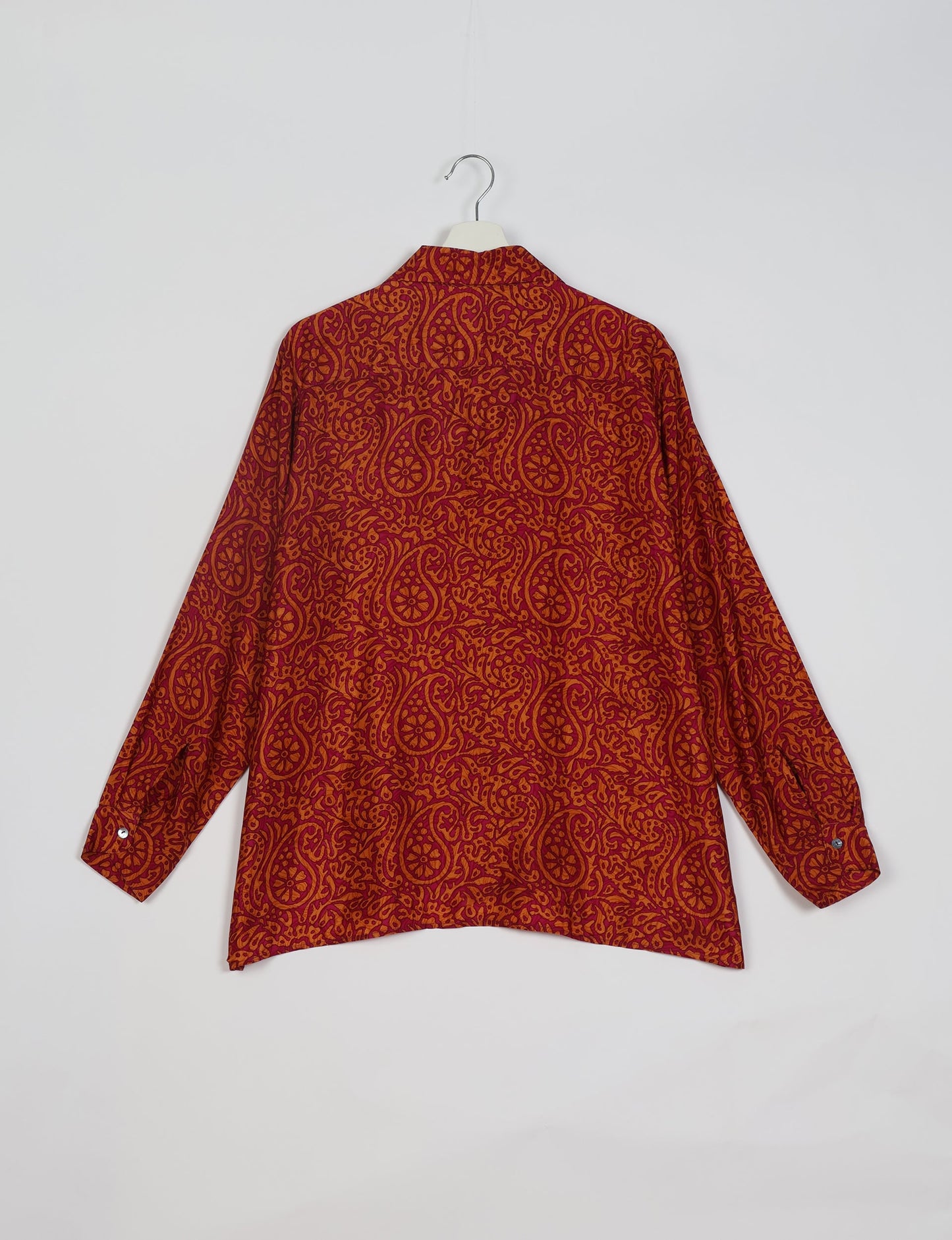 A person wearing a Resort Shirt, a sustainable fashion choice made from recycled materials.