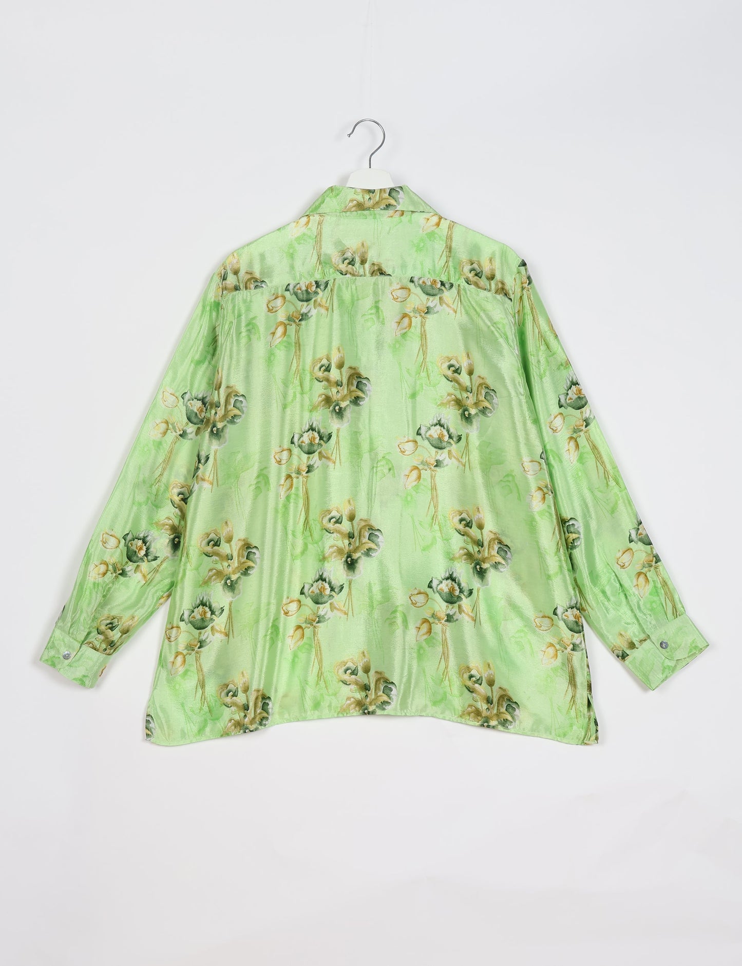 A person wearing a Resort Shirt, a sustainable fashion choice made from recycled materials.