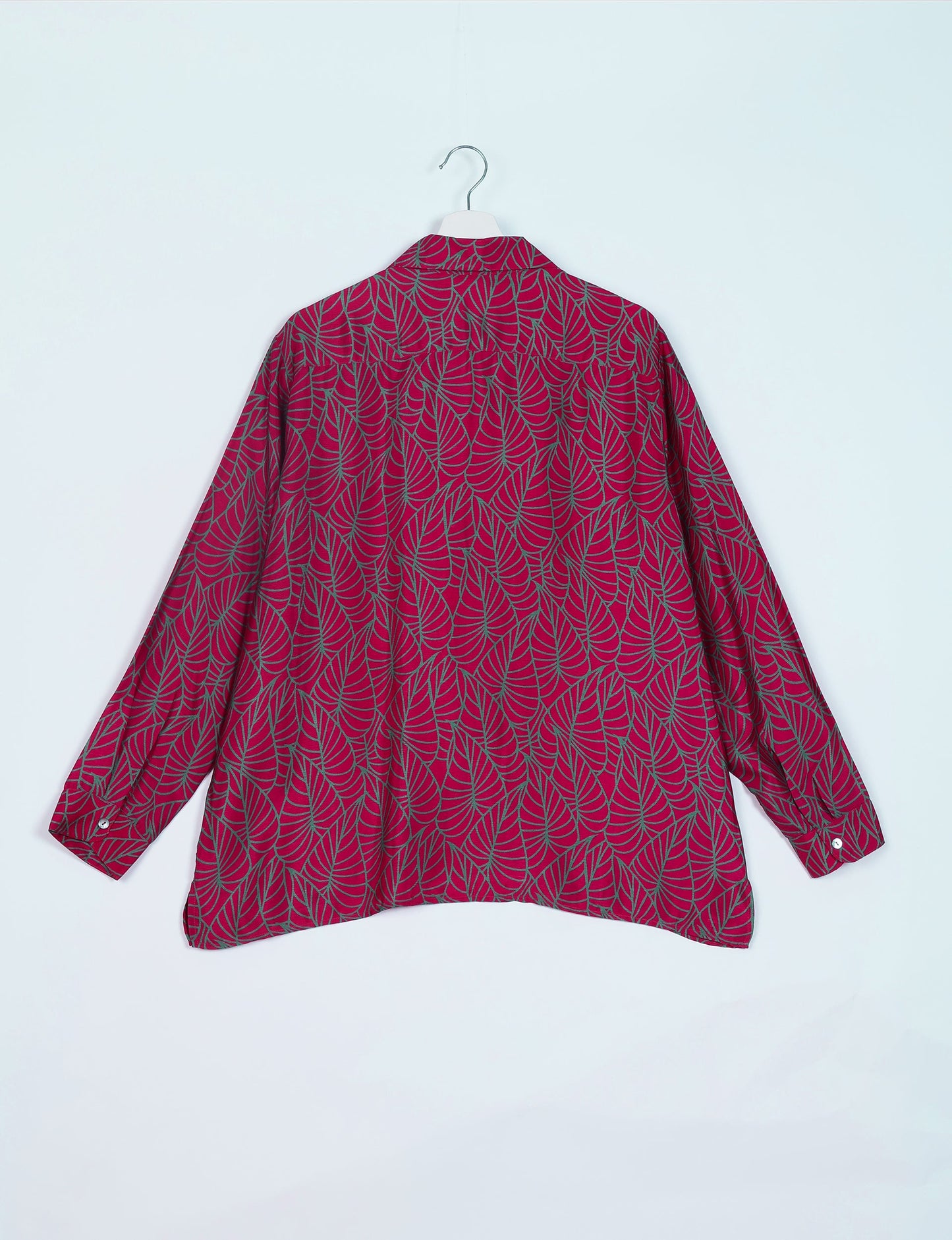 A person wearing a Resort Shirt, a sustainable fashion choice made from recycled materials.