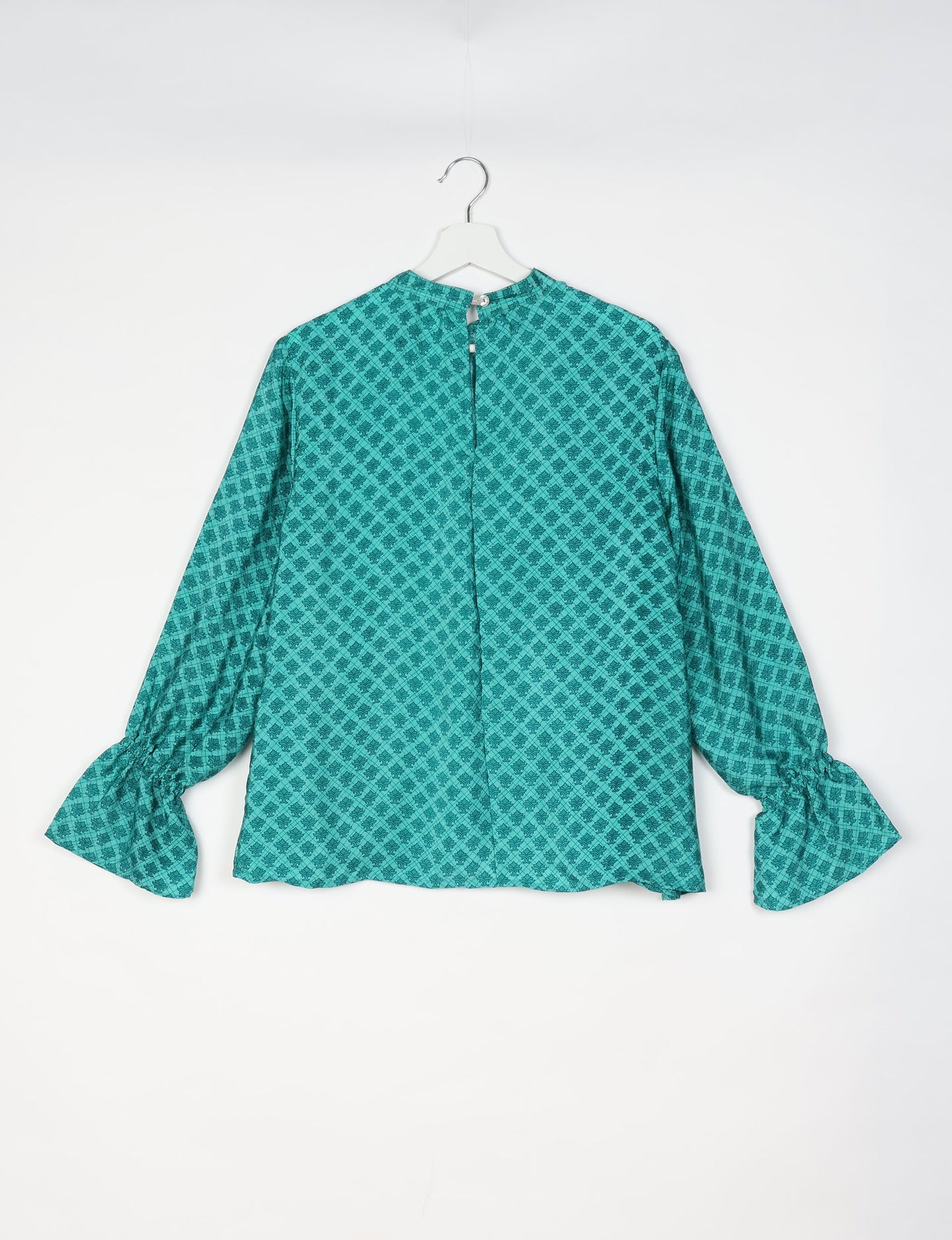 Flowing blouse with peasant sleeves and gathered neckline made from upcycled garments and repurposed clothing, showcasing eco clothing and fair trade fashion in a stylish, comfortable design.