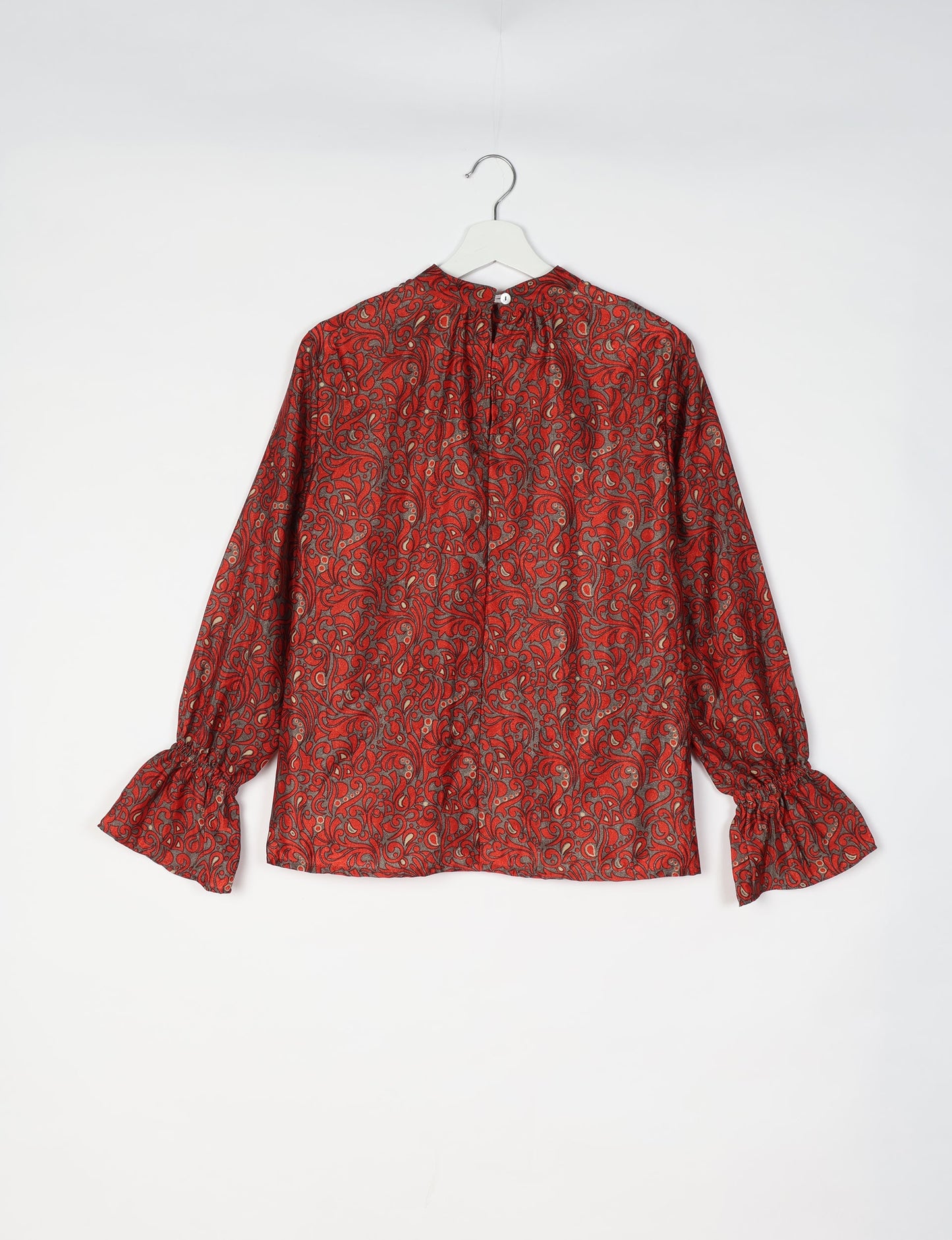 Flowing blouse with peasant sleeves and gathered neckline made from upcycled garments and repurposed clothing, showcasing eco clothing and fair trade fashion in a stylish, comfortable design.